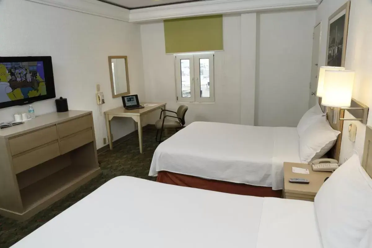 Photo of the whole room, Bed in Hotel Monterrey Macroplaza