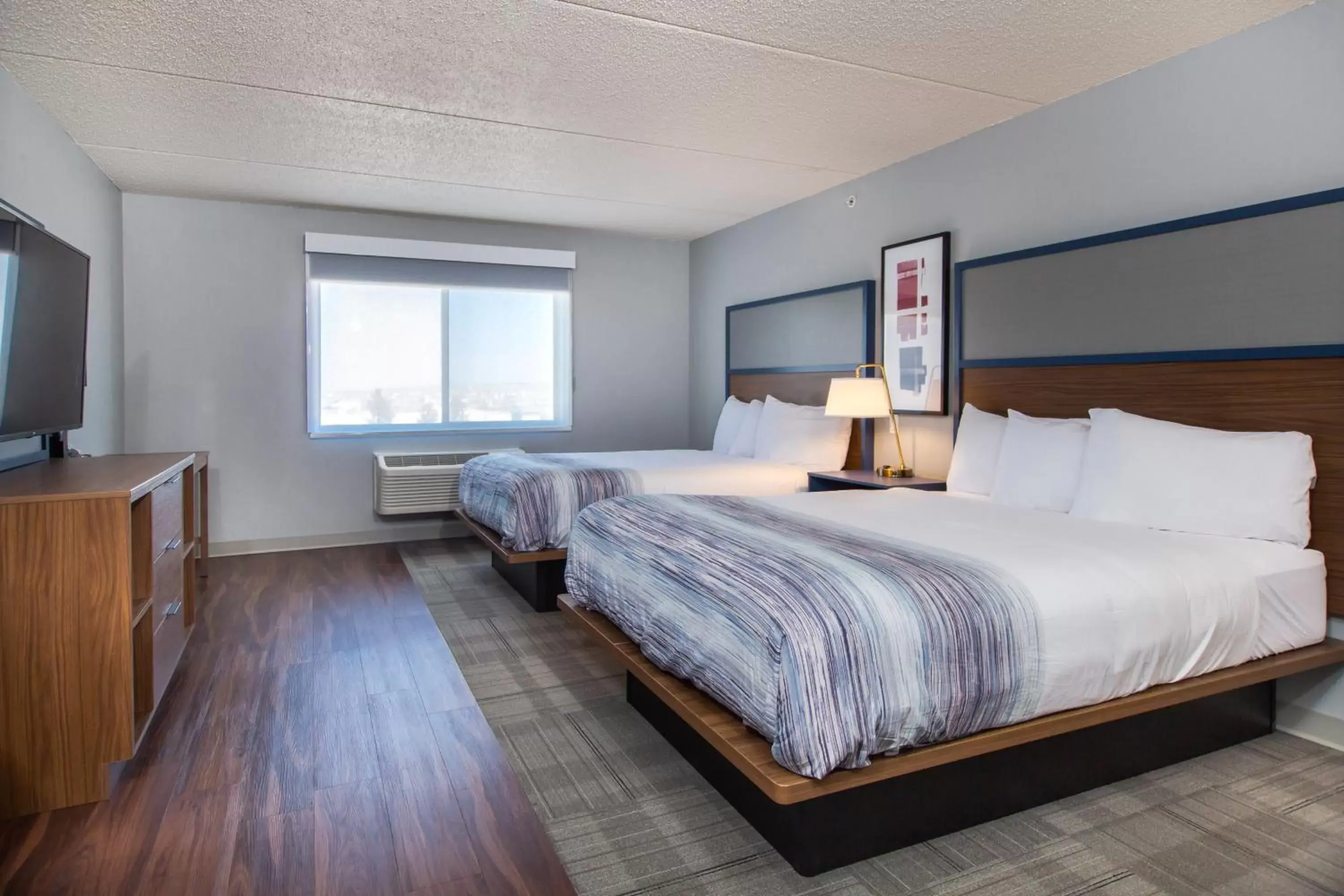 Bed in AmericInn by Wyndham Rapid City