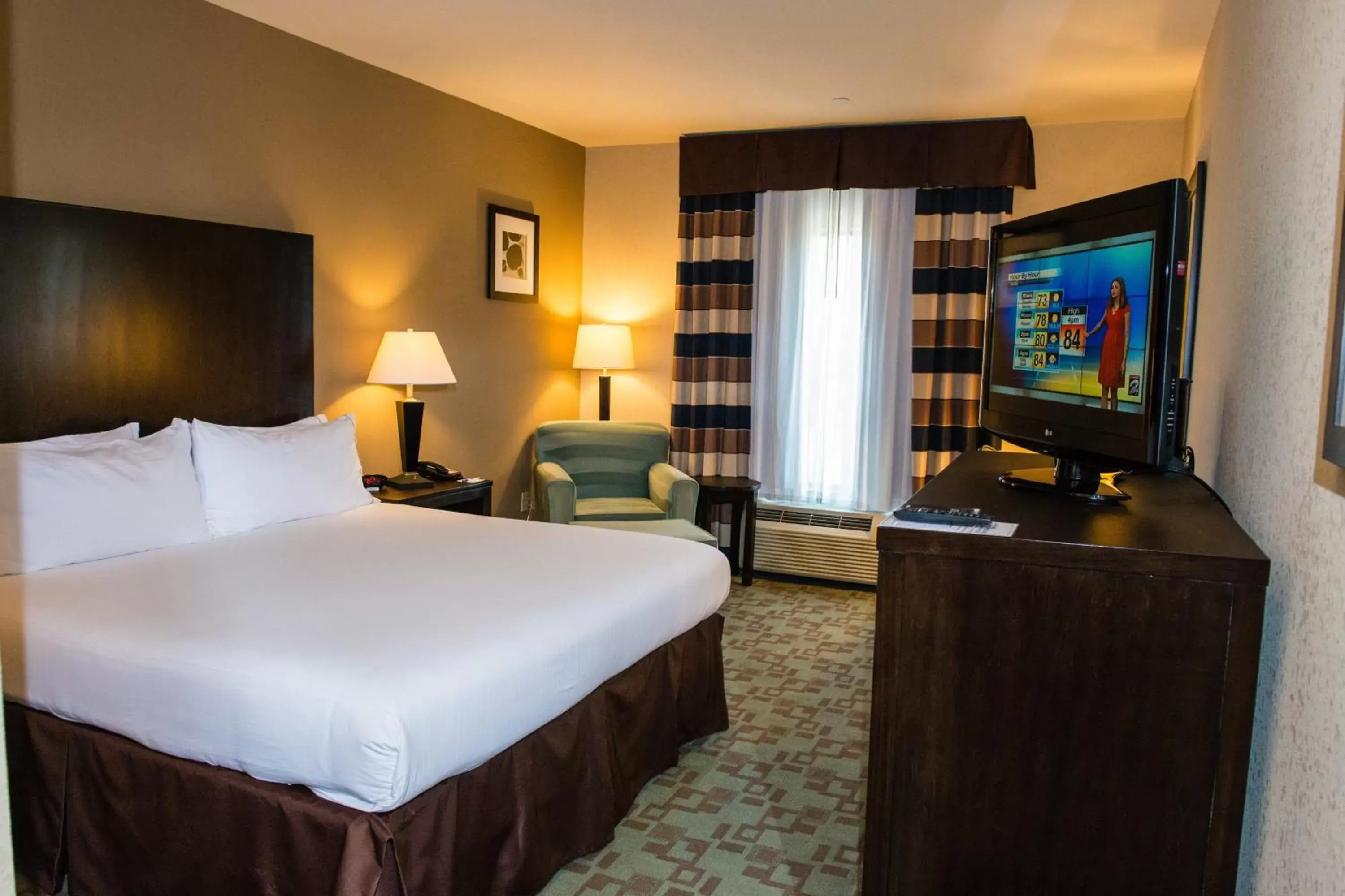 Photo of the whole room, TV/Entertainment Center in Holiday Inn Express Hotel & Suites Houston NW Beltway 8-West Road, an IHG Hotel