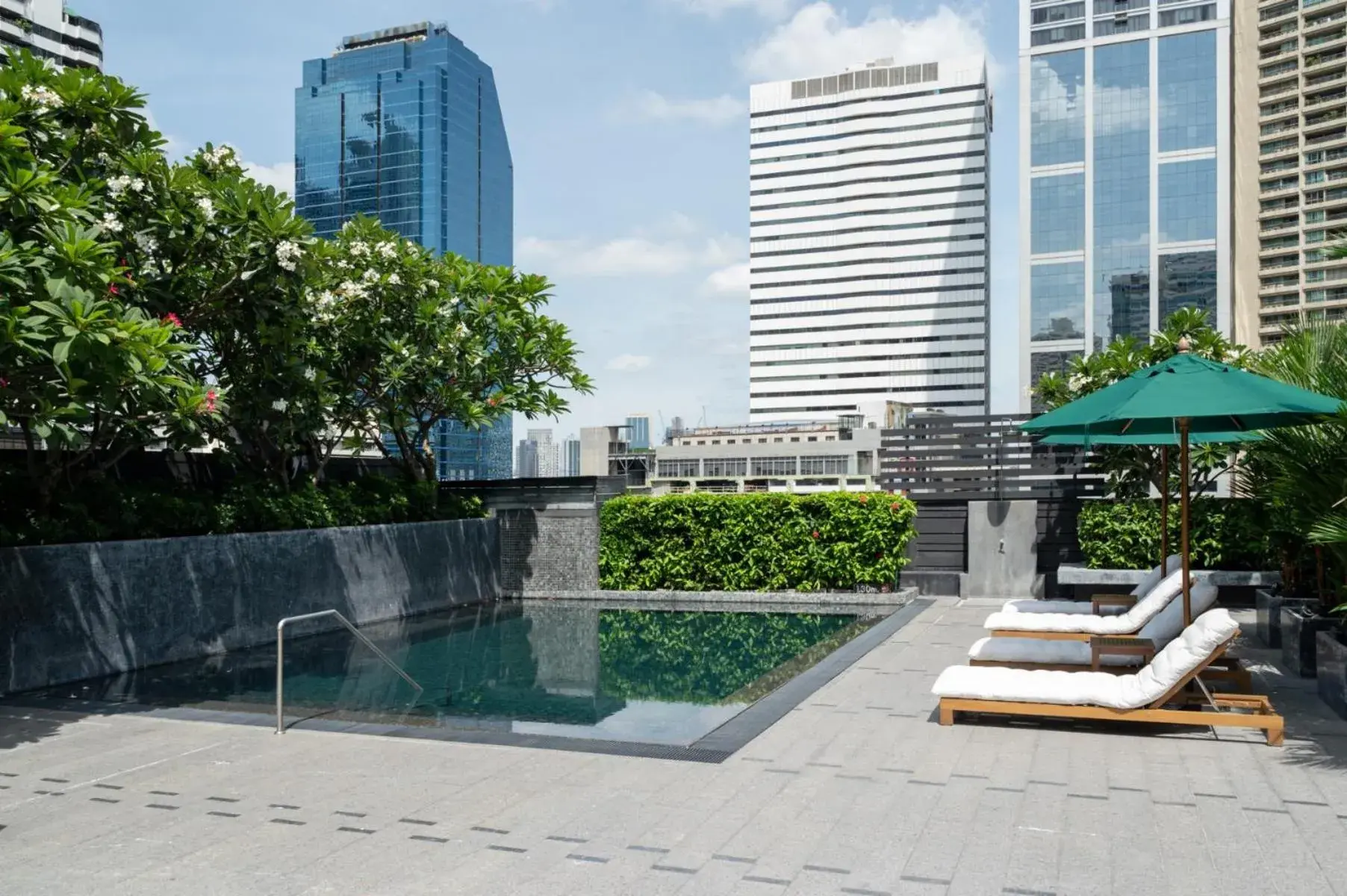 Swimming pool, Property Building in Maitria Hotel Sukhumvit 18 Bangkok – A Chatrium Collection