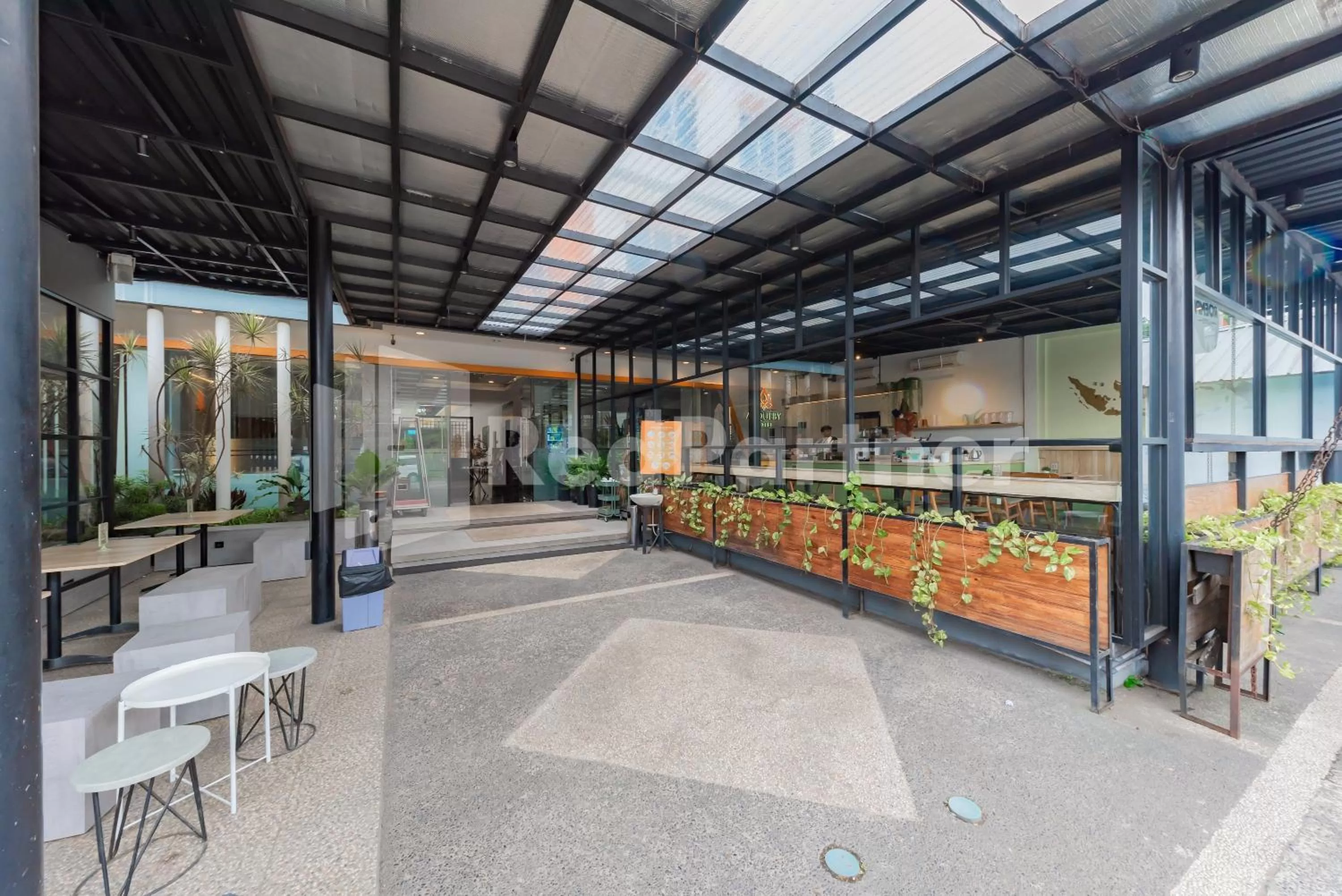 Property building in Alqueby Hotel near Kiara Artha Park & Trans Studio Mall Mitra RedDoorz