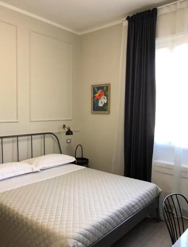 Bed in LA DAMA ROOM&BREAKFAST