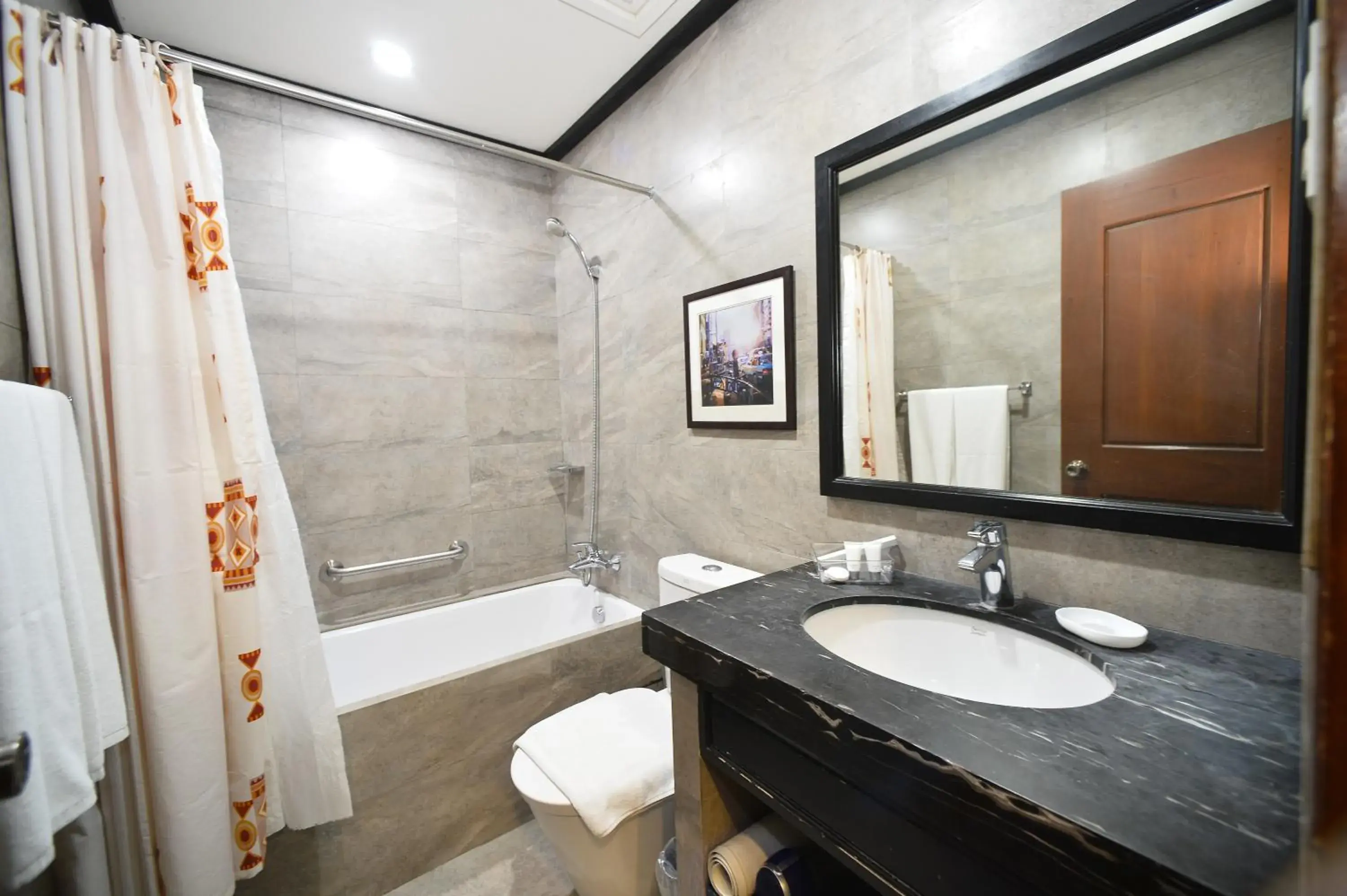 Bathroom in Paragon Hotel And Suites