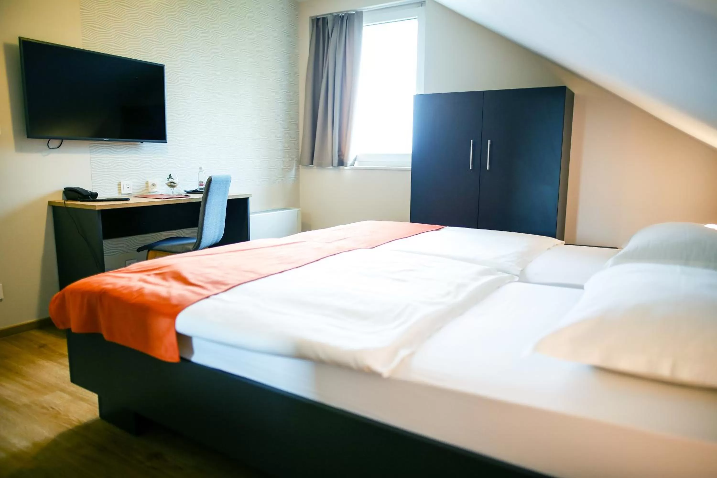 Bed in Ambient Hotel