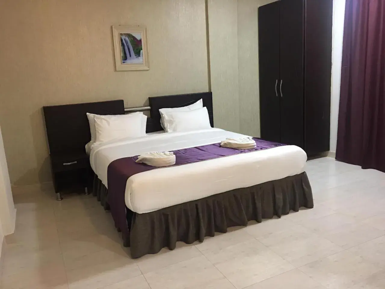 Bed in Gateway Salalah Apartments