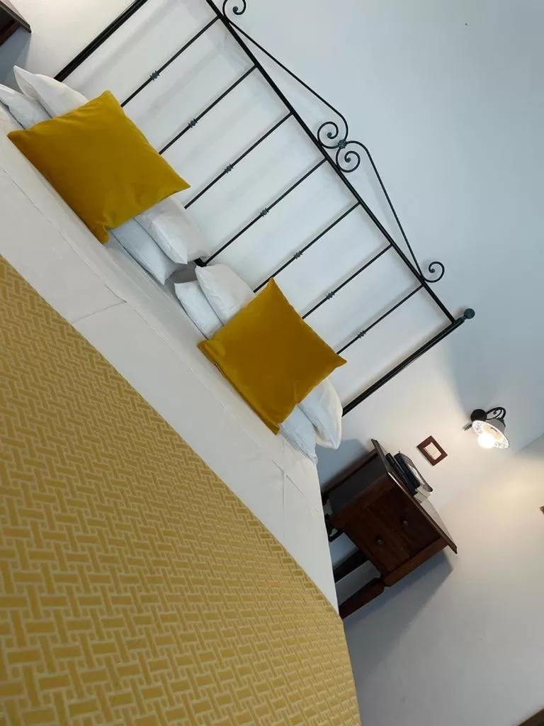 Bed in Ai Dammusi Rooms