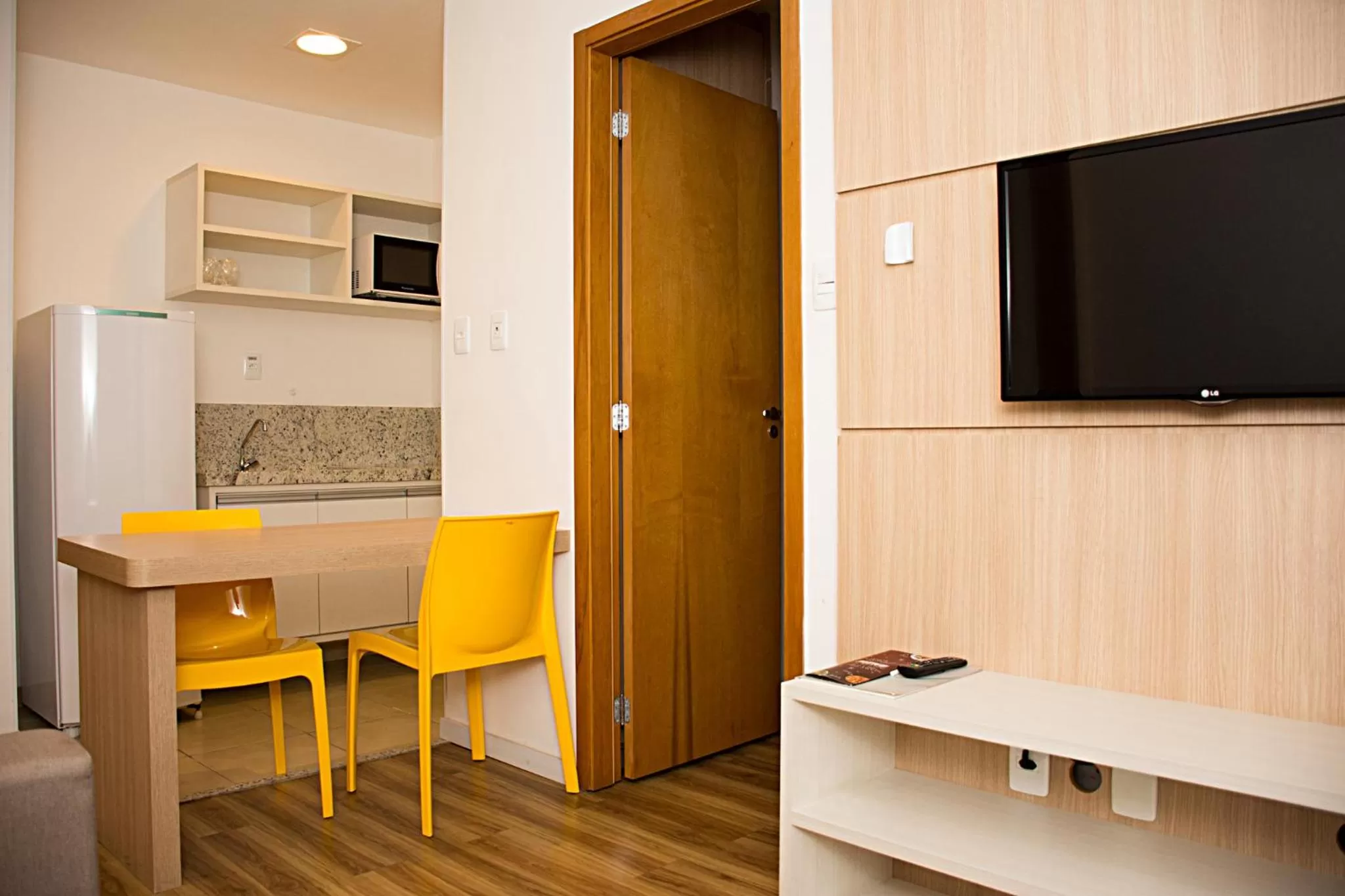 Communal lounge/ TV room in Unico Apart Hotel