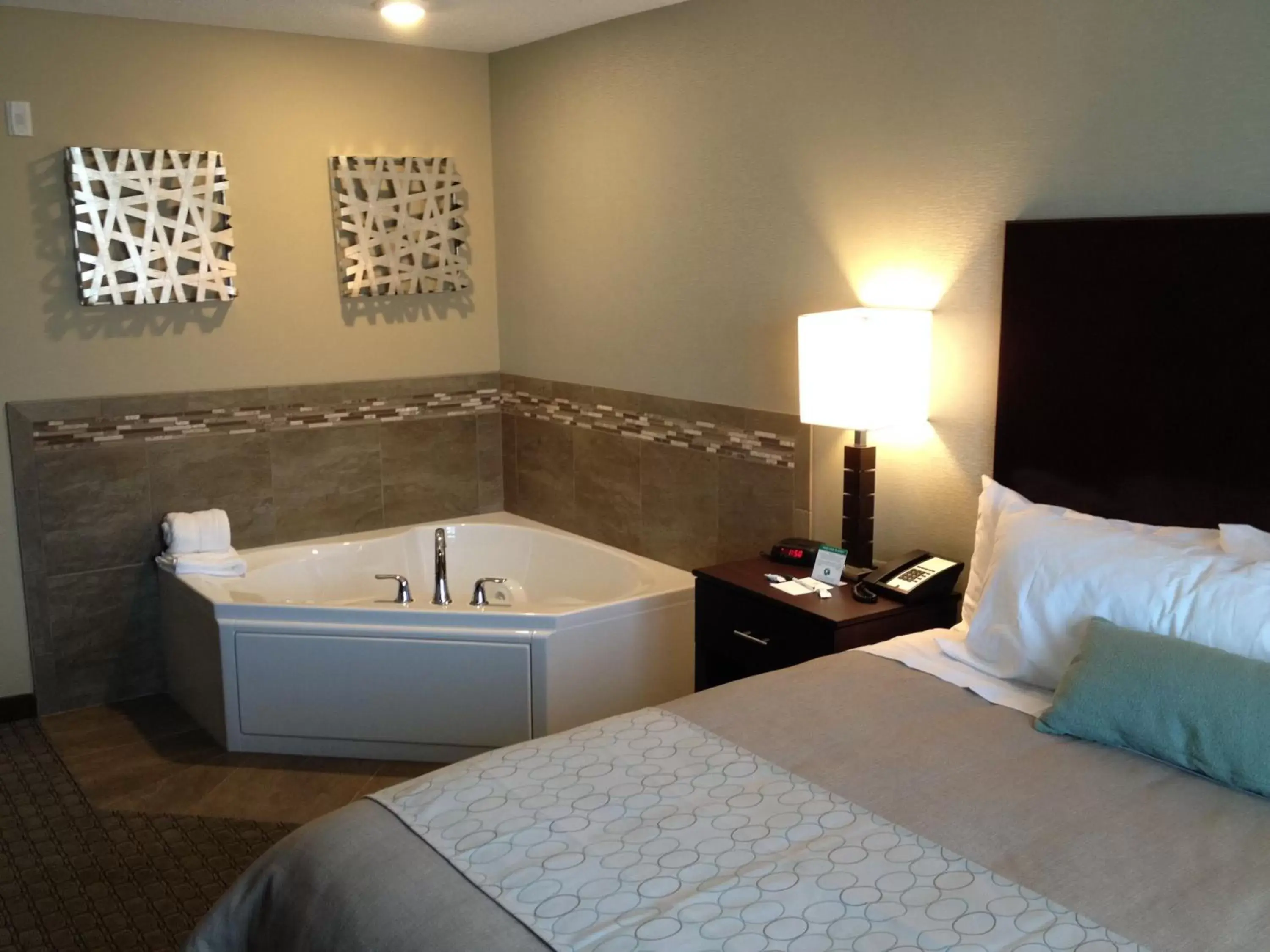 Bed in GrandStay Hotel & Suites - Glenwood