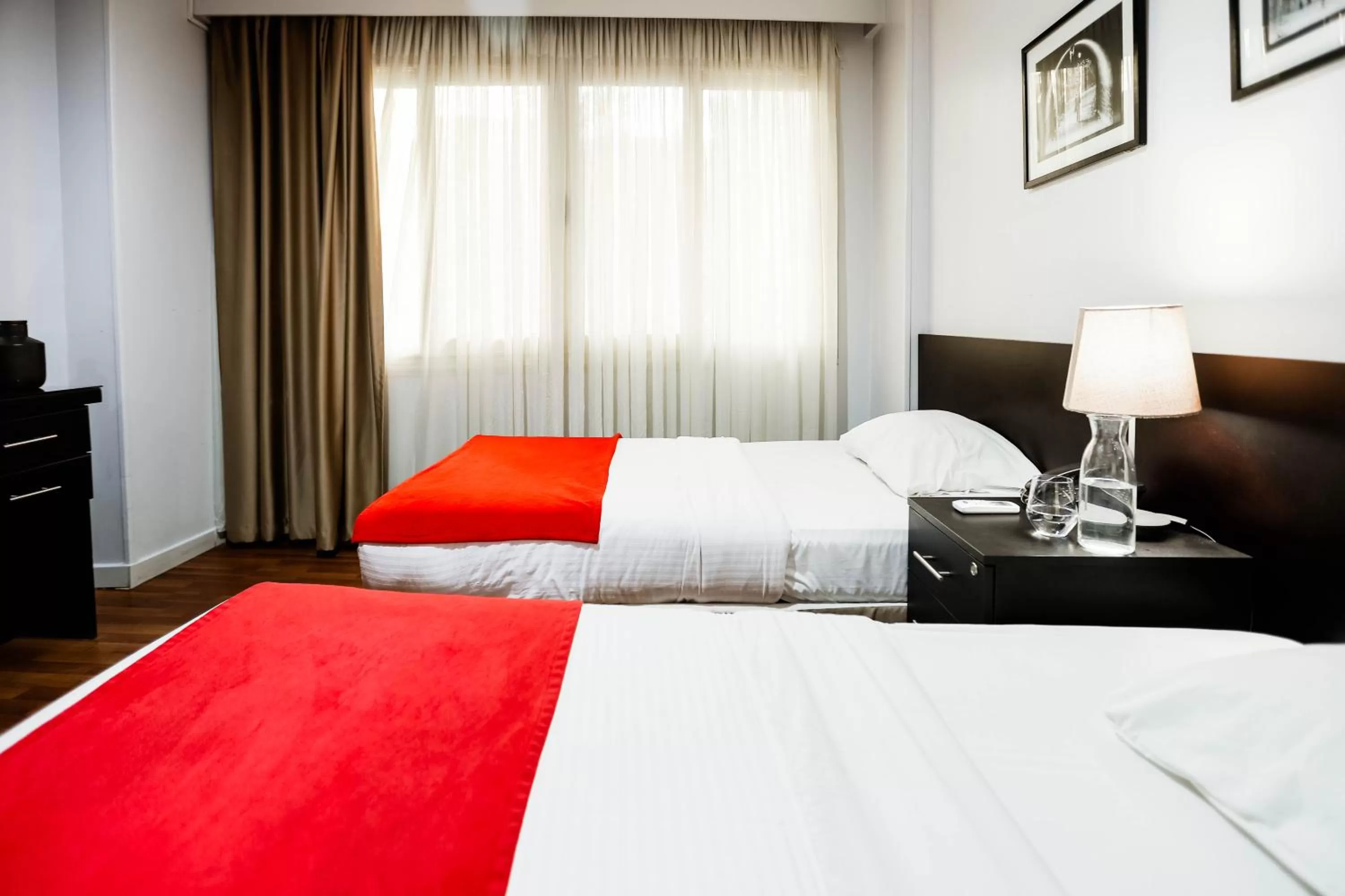 Bed in NewCity Hotel & Suites