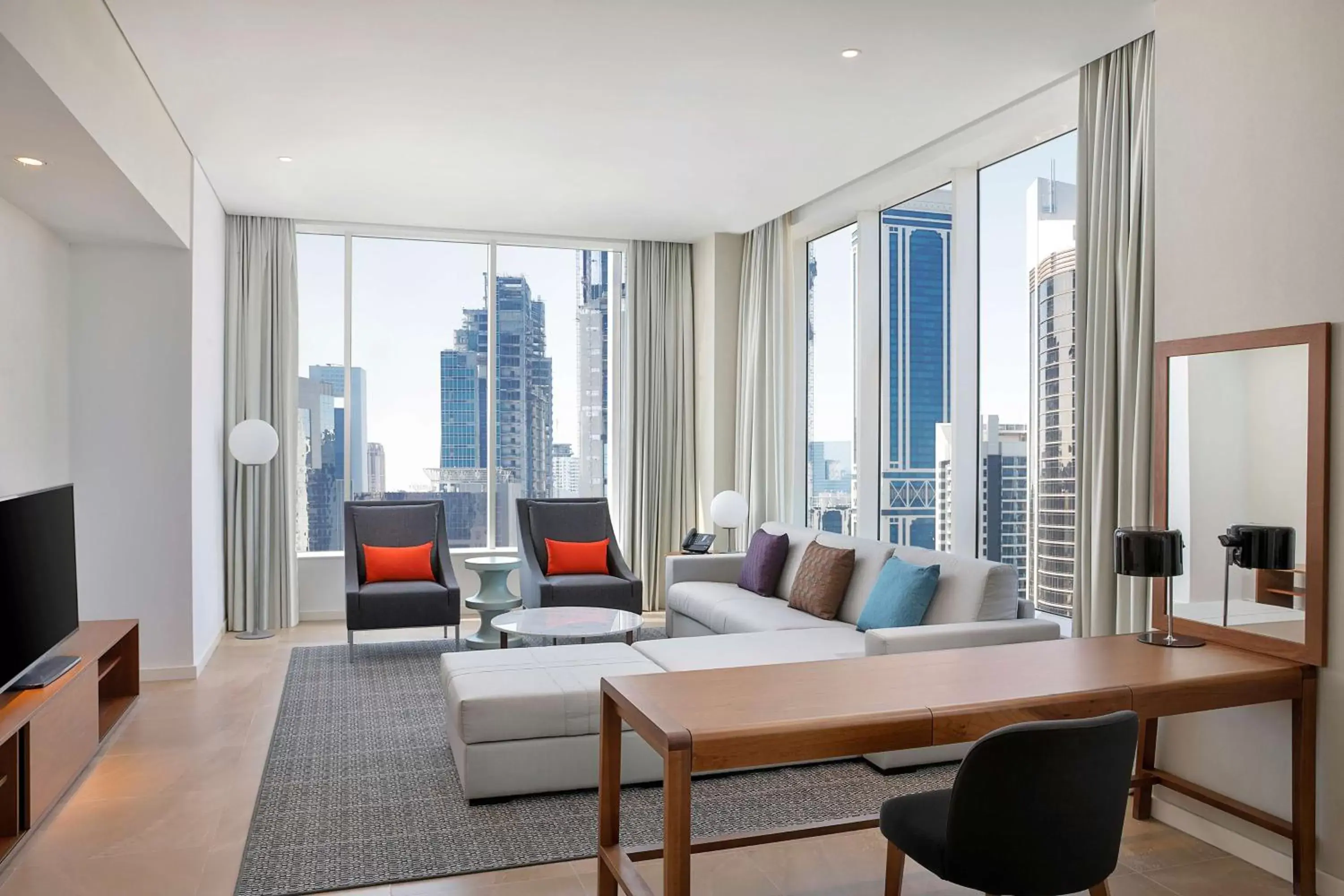 Living room, Seating Area in Aleph Doha Residences, Curio Collection By Hilton
