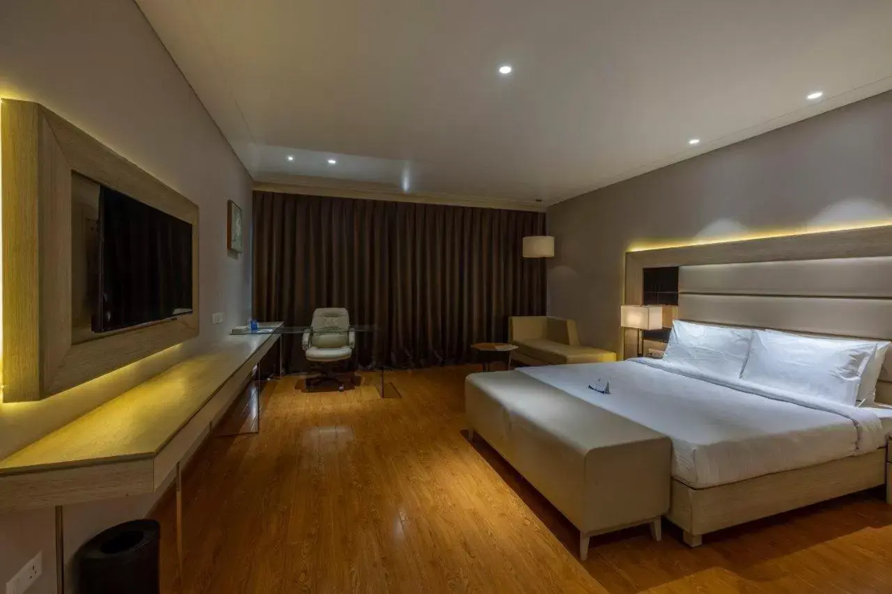 Bedroom in Sarovar Portico Morbi