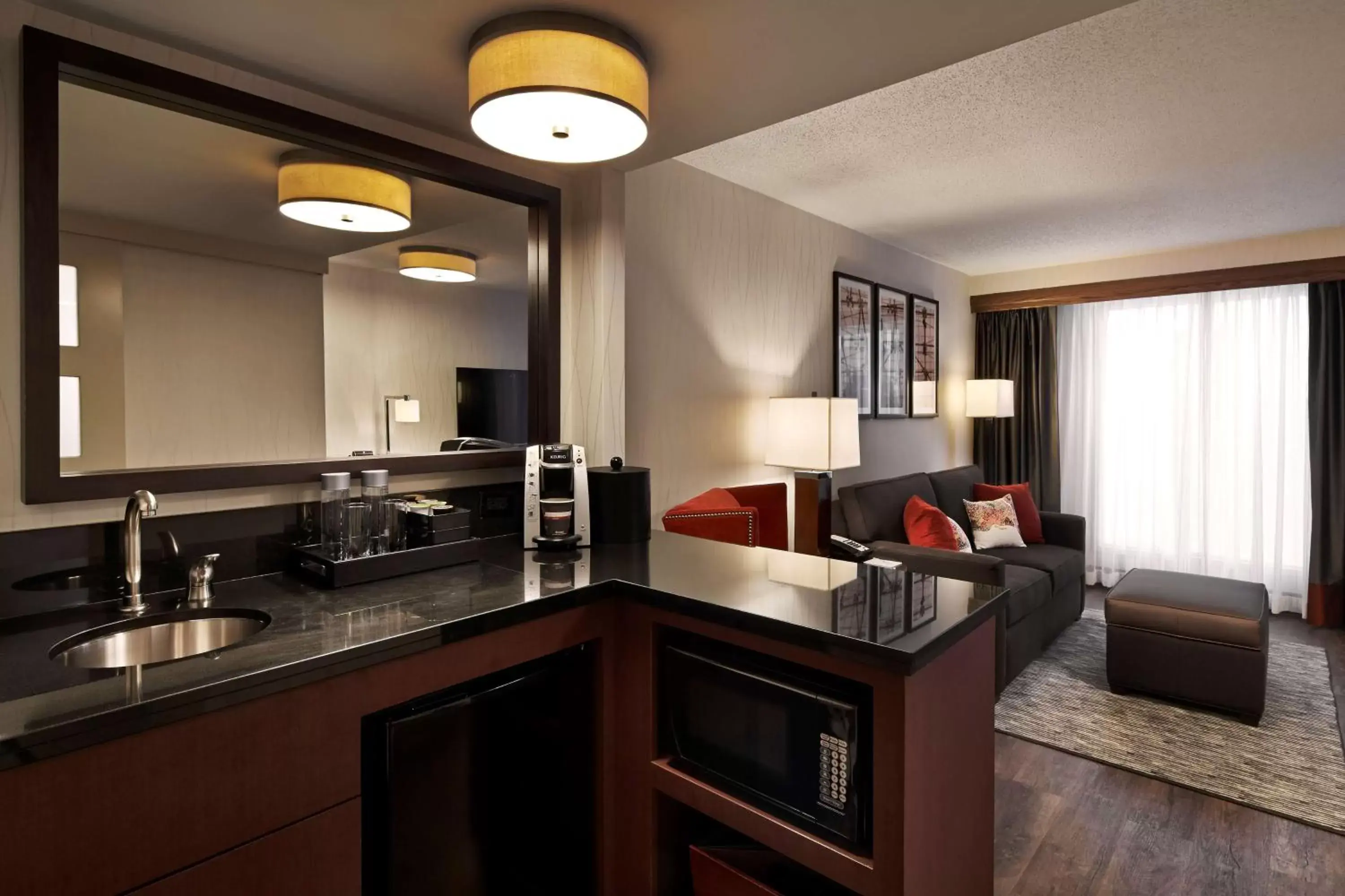 Living room, Kitchen/Kitchenette in Embassy Suites by Hilton Washington DC Chevy Chase Pavilion