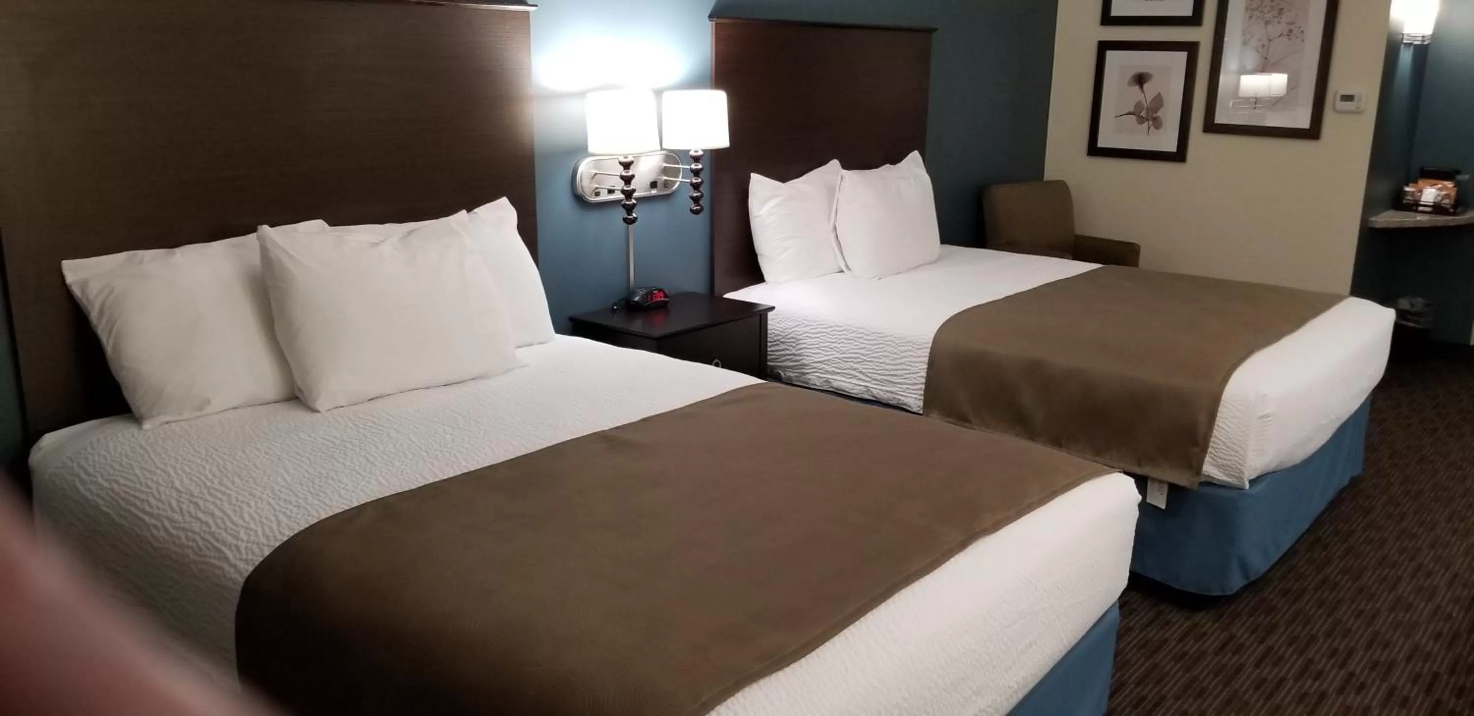 Bed in AmericInn by Wyndham Sioux Falls North