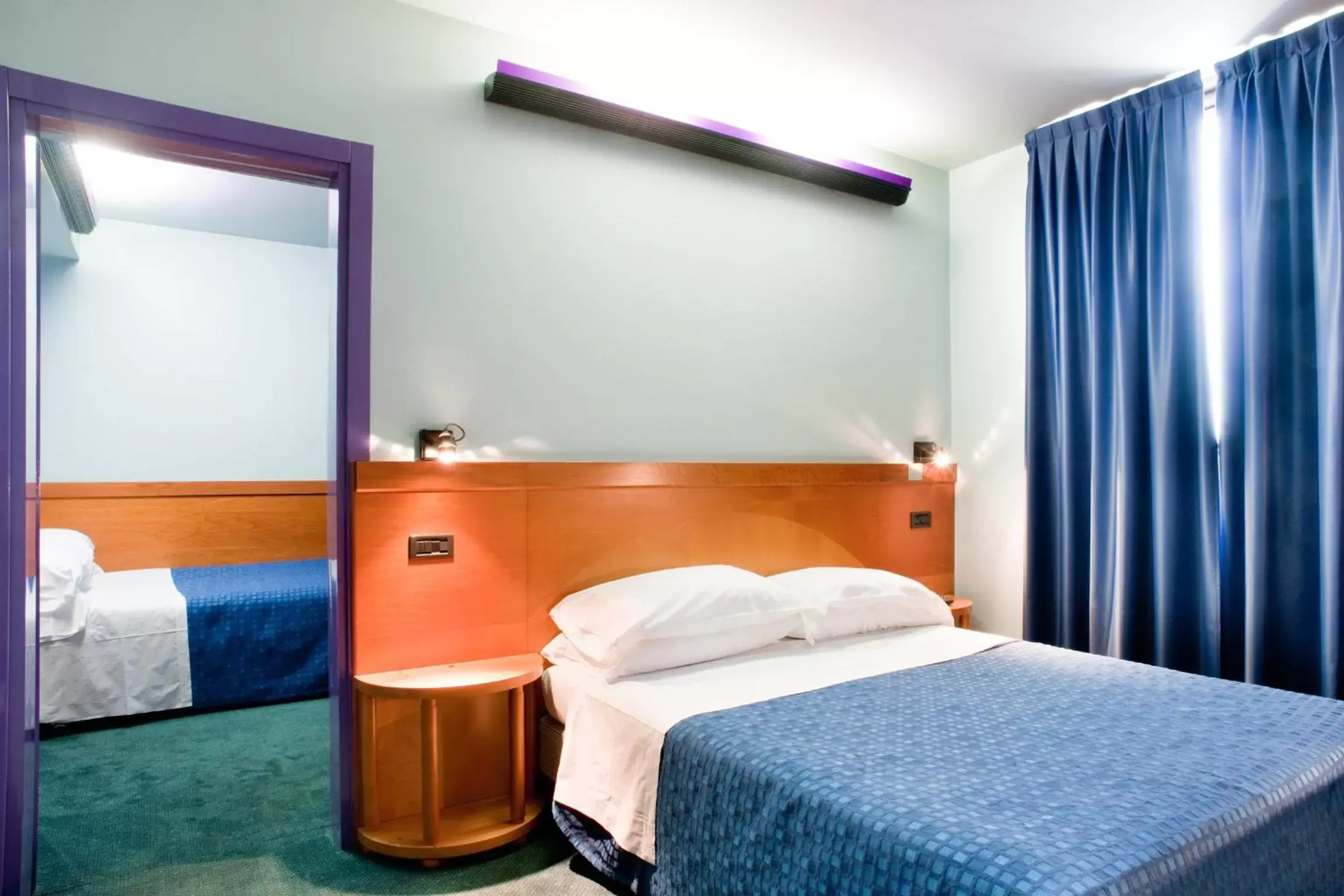 Bed in Hotel Gardenia
