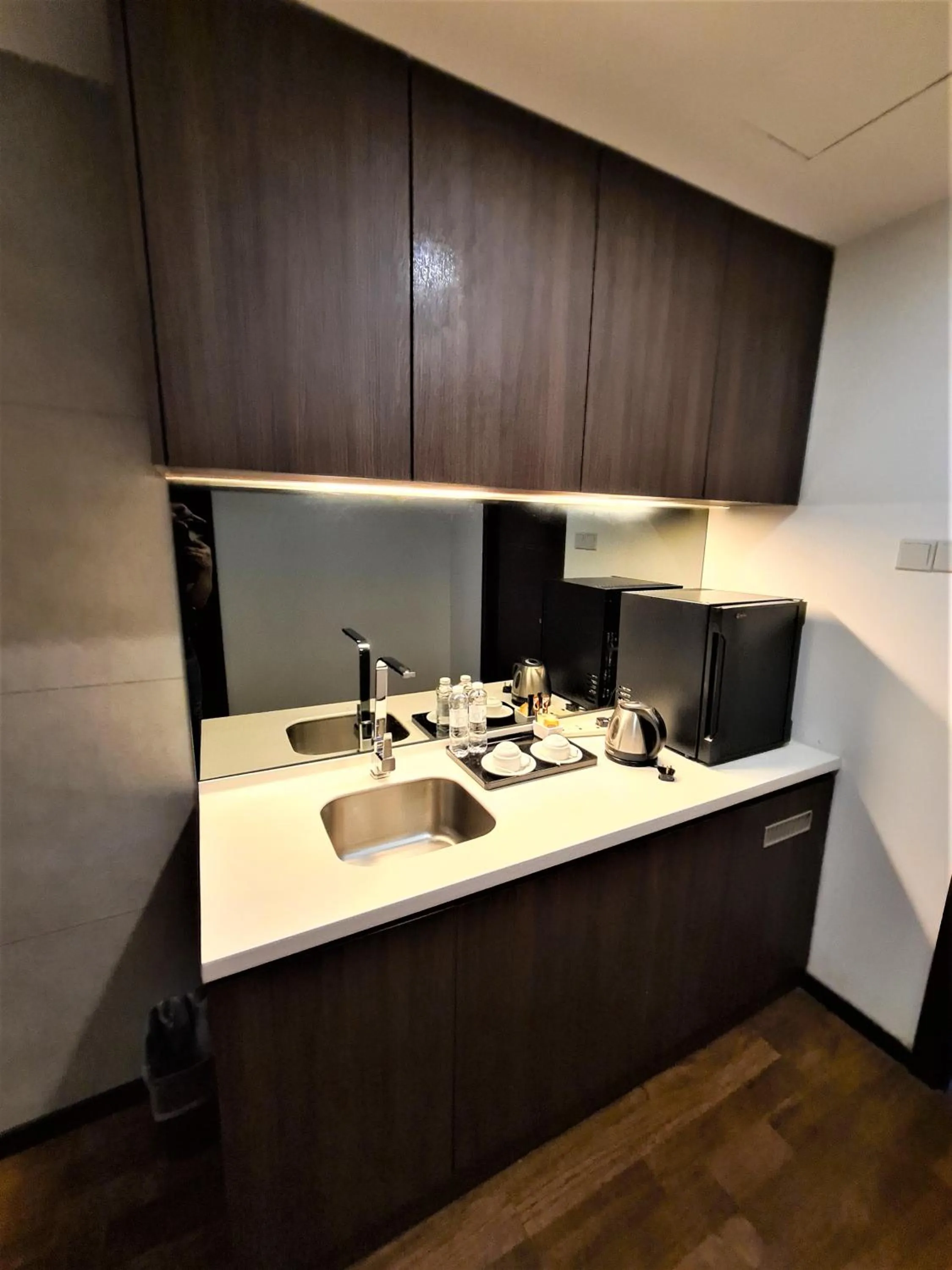 Kitchen or kitchenette in Nexus Regency Suites & Hotel