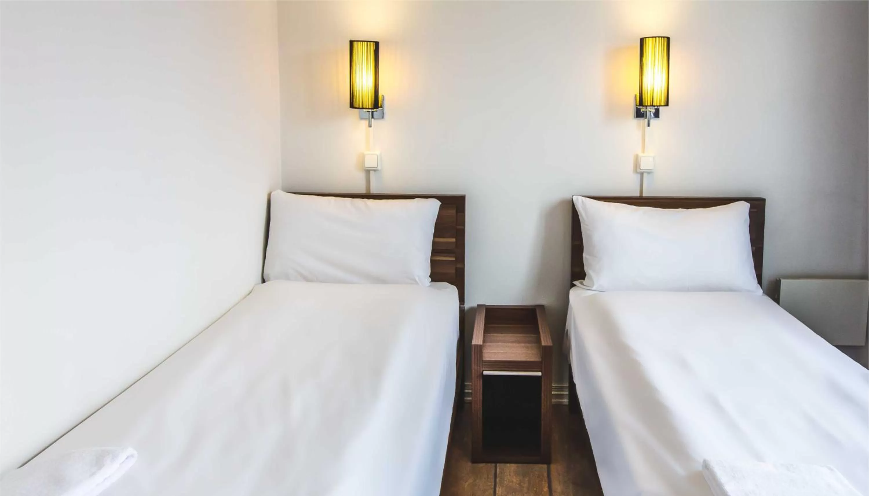 Bed in Central City Apartments