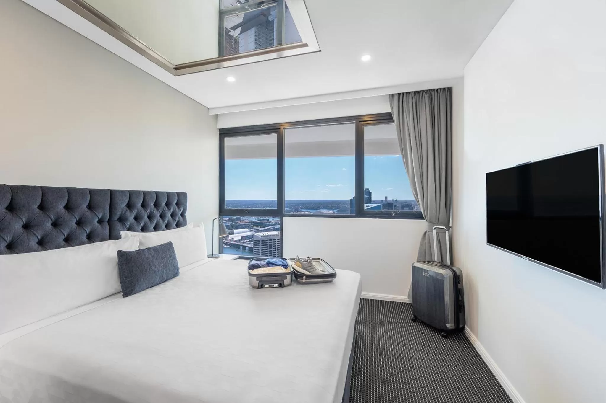 Bed in Meriton Suites Kent Street, Sydney