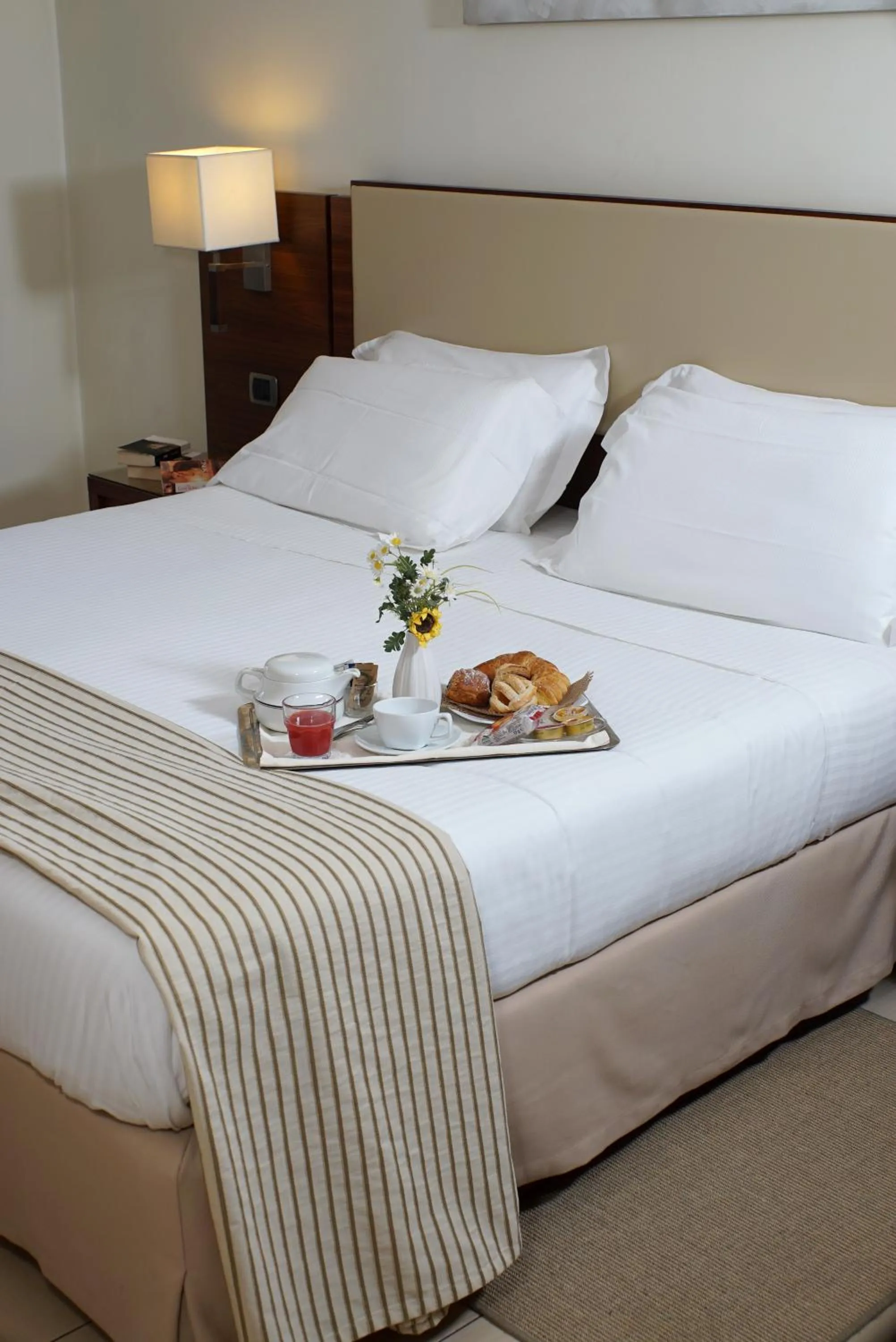 Bed in Suites & Residence Hotel
