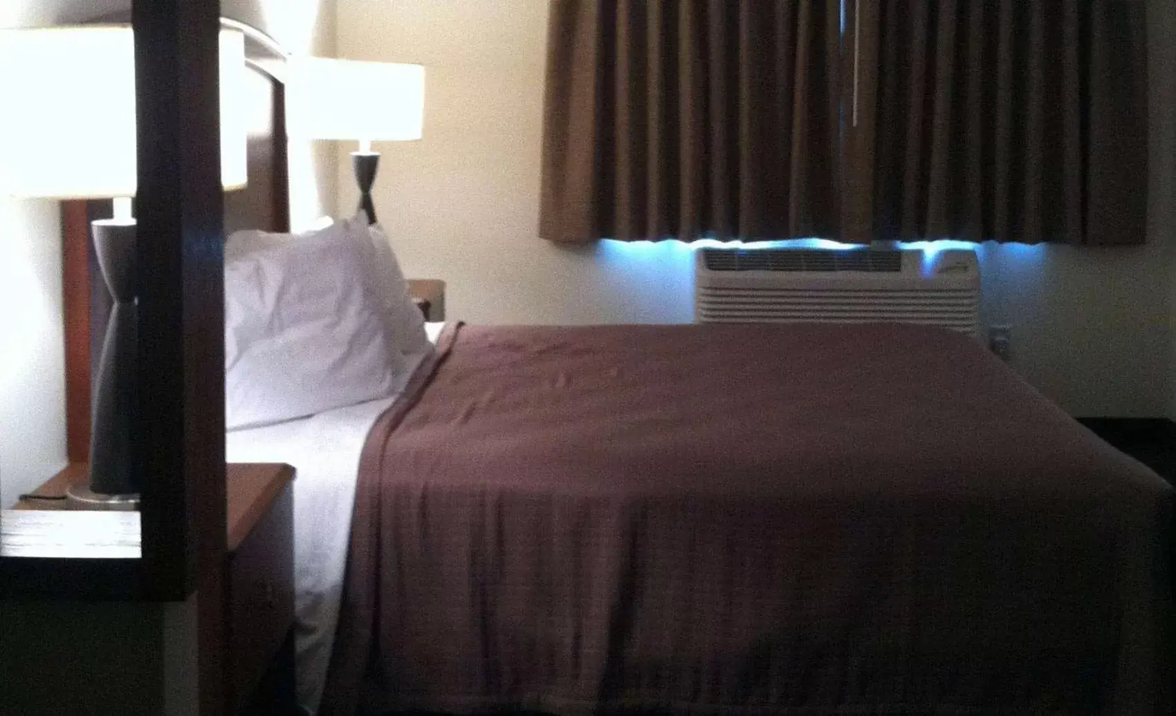 Bed in AmericInn by Wyndham Beulah