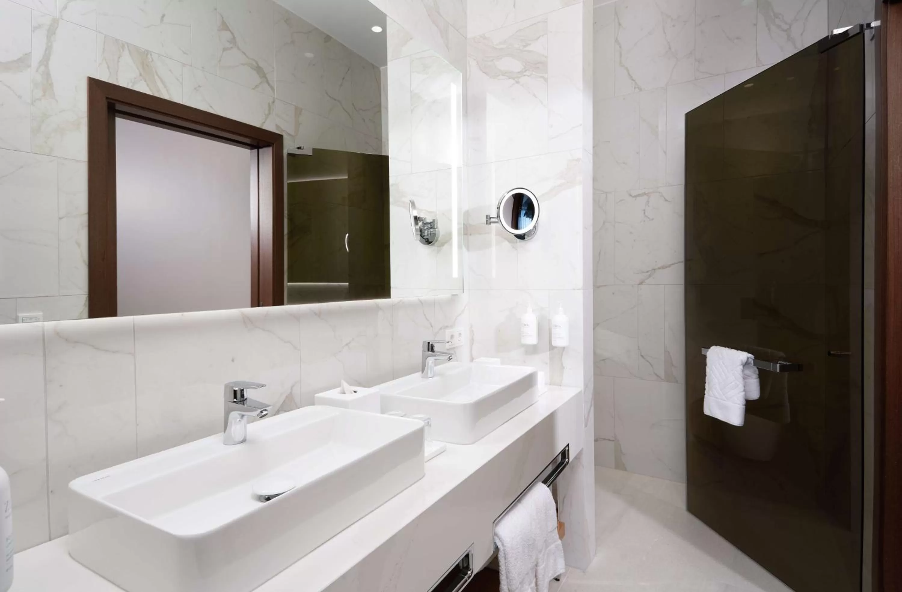 Bathroom in Iceland Parliament Hotel, Curio Collection By Hilton