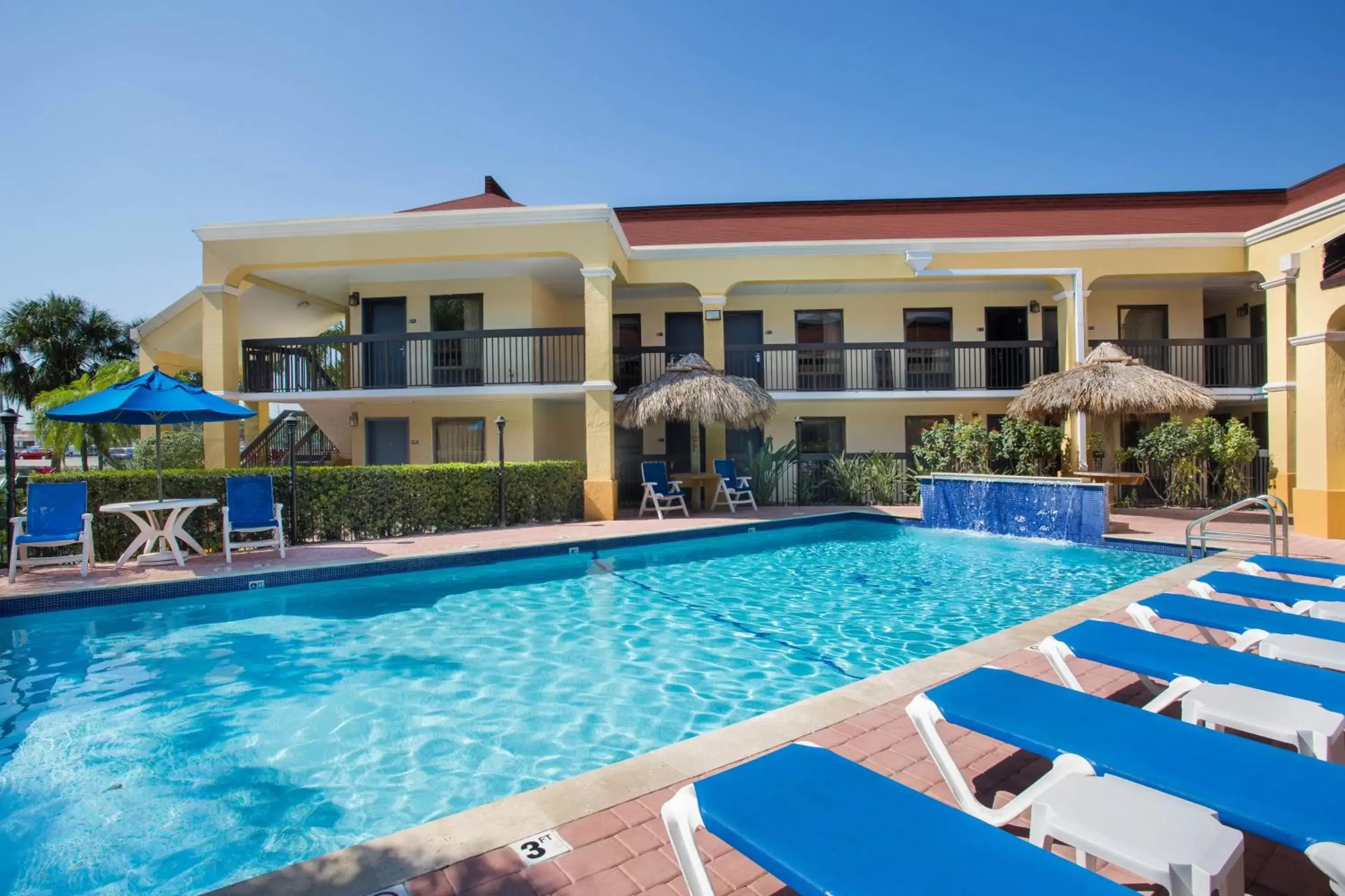 Swimming pool, Property Building in Days Inn by Wyndham Florida City