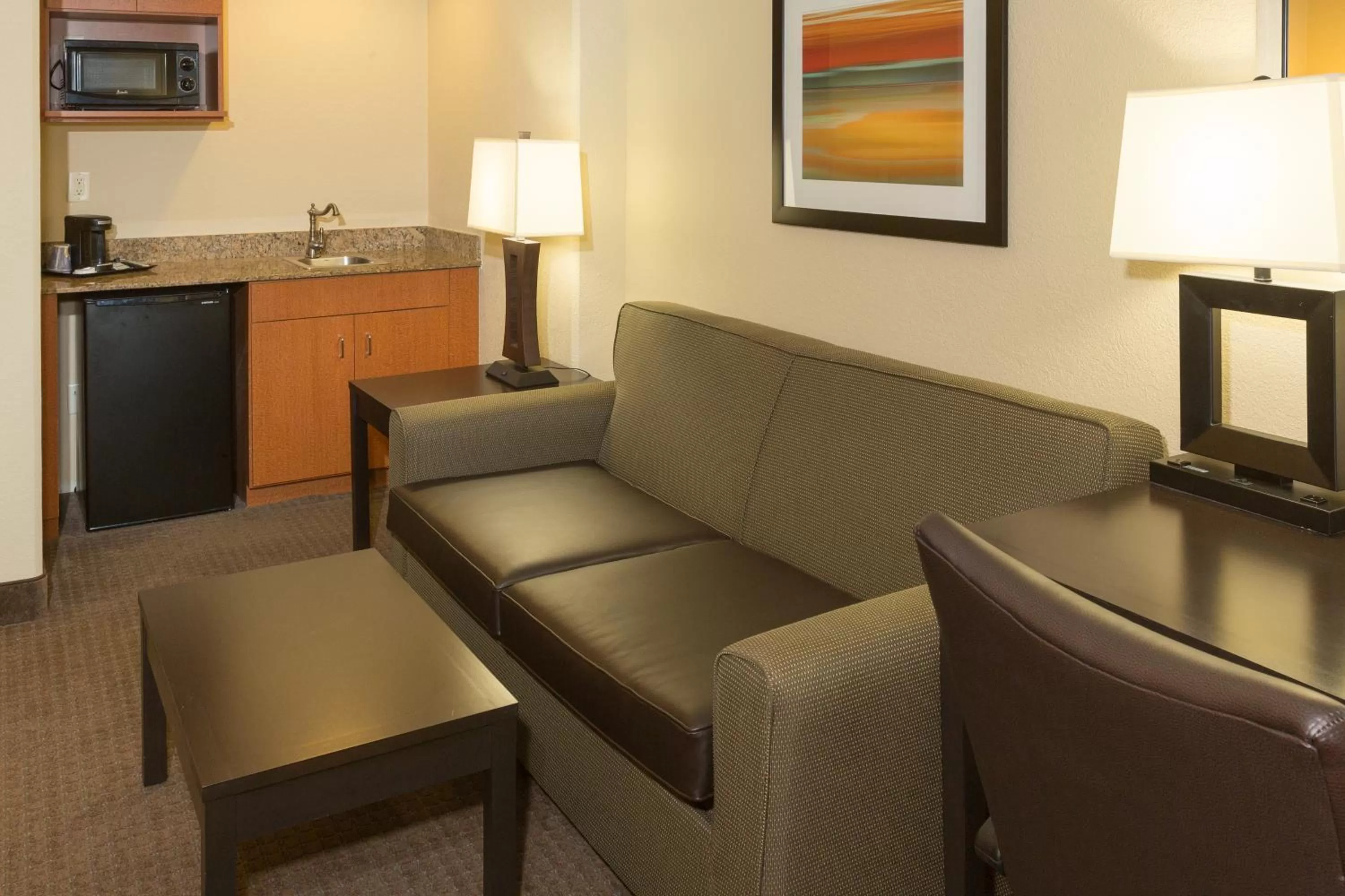 Seating area in Holiday Inn Express Hotel & Suites Jacksonville Airport by IHG