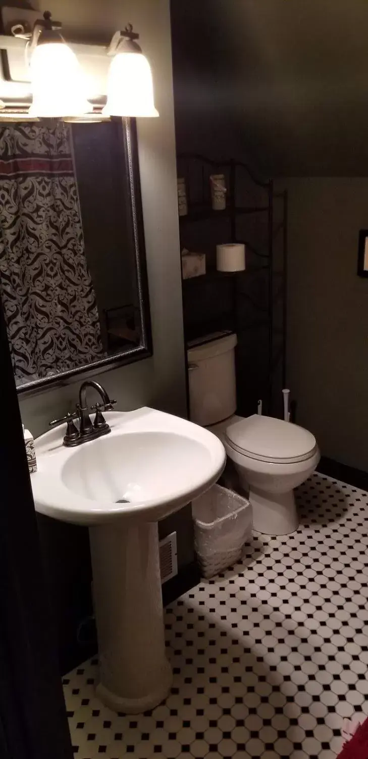 Toilet, Bathroom in Historic Victorian Inn