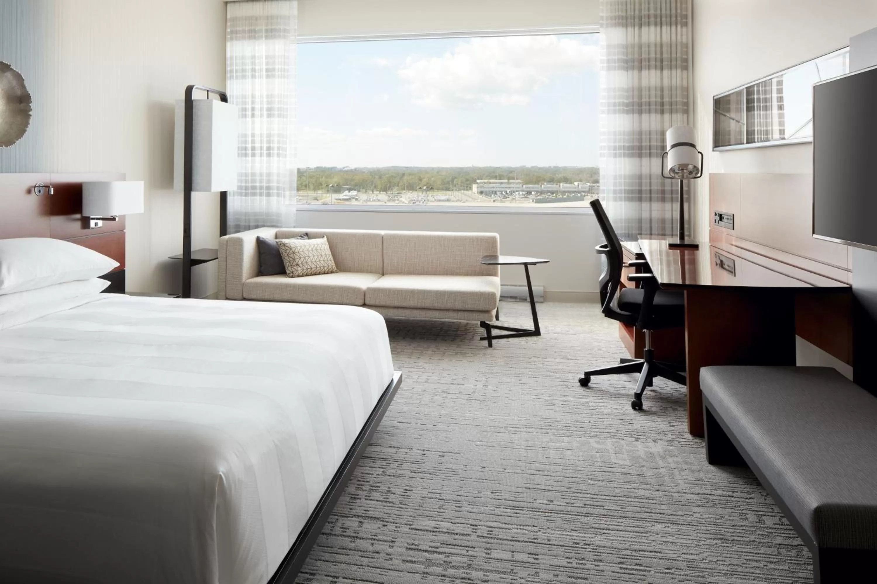 Photo of the whole room, Bed in Marriott Montreal Airport In-Terminal Hotel