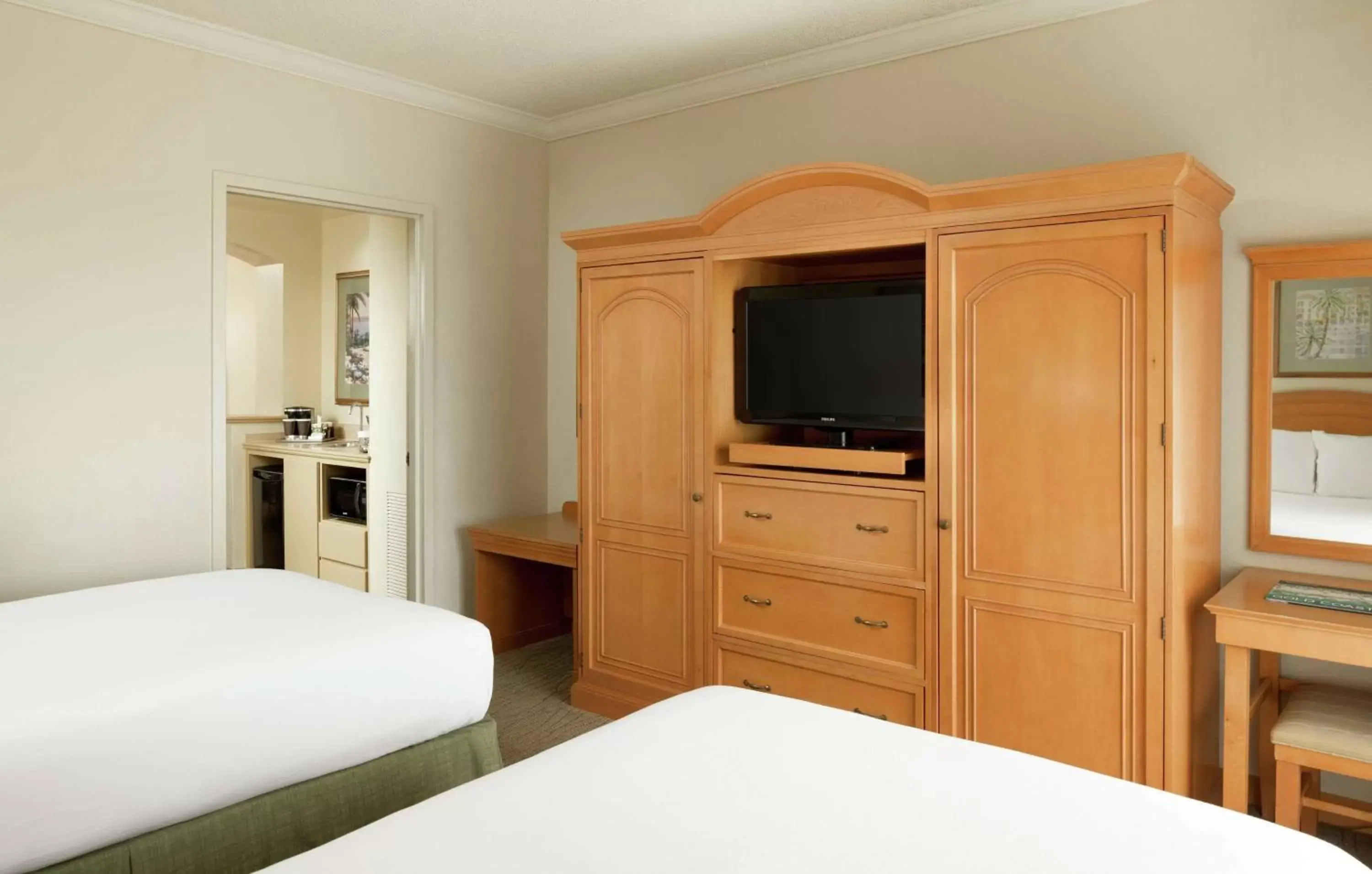 Bedroom, TV/Entertainment Center in Hilton Boca Raton Suites