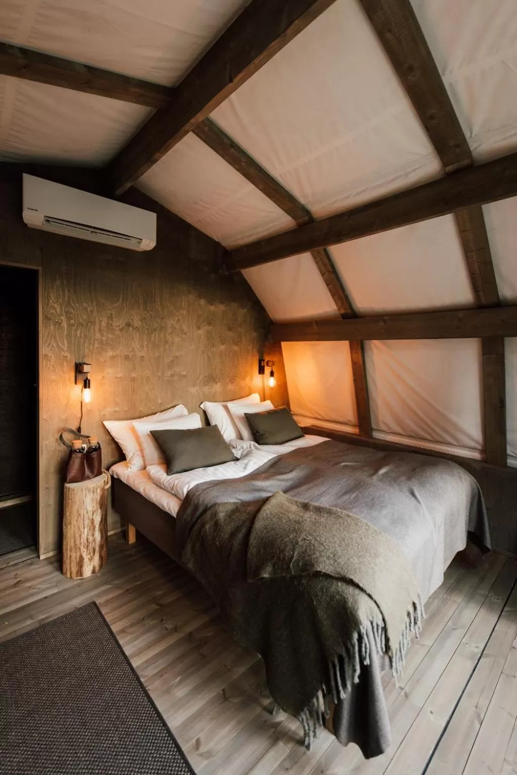 Bed in Haltia Lake Lodge nature boutique hotel & glamping