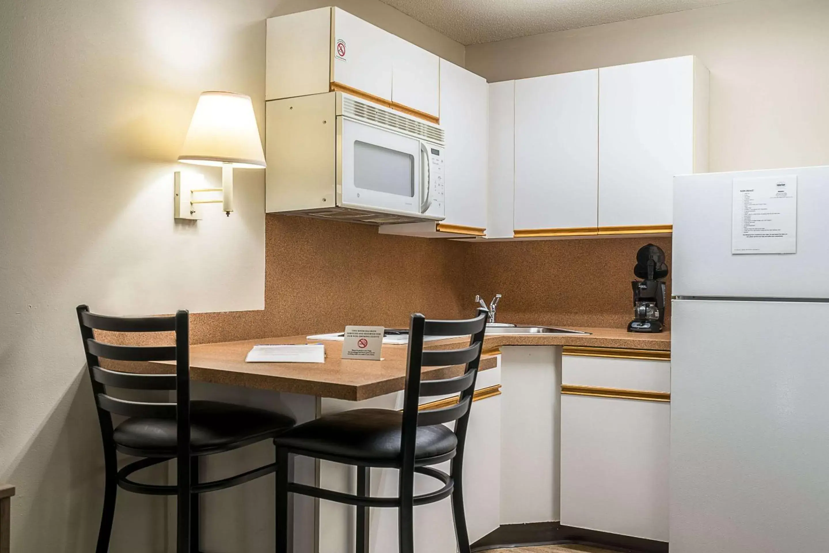 Kitchen or kitchenette, Dining Area in Suburban Studios of Wilmington