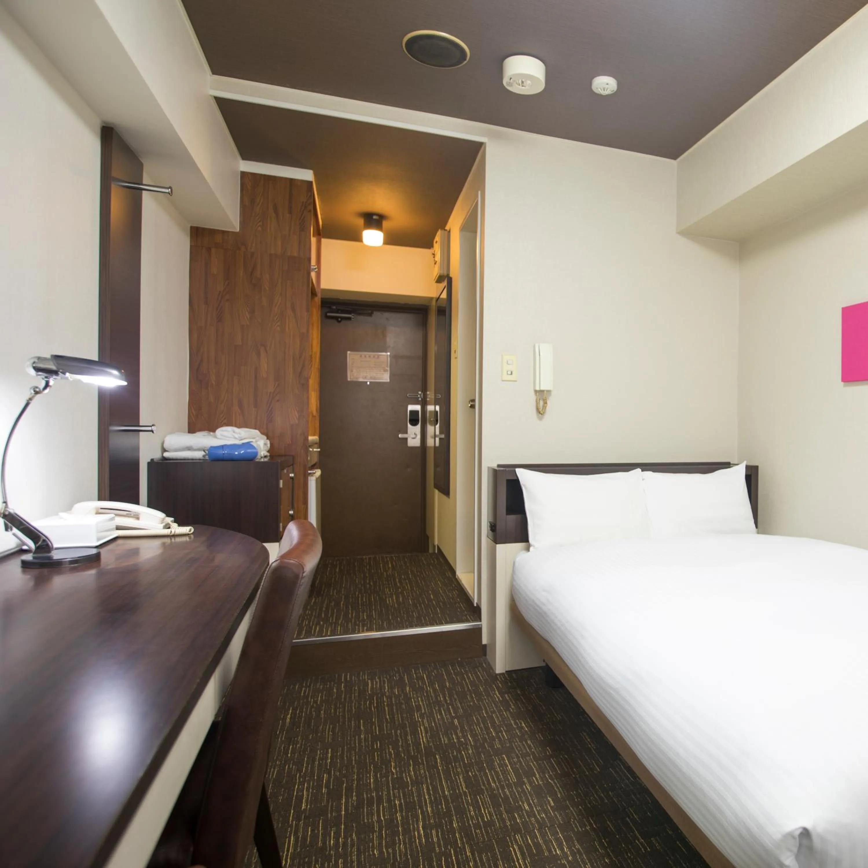 Bed in FLEXSTAY INN Kawasaki Kaizuka