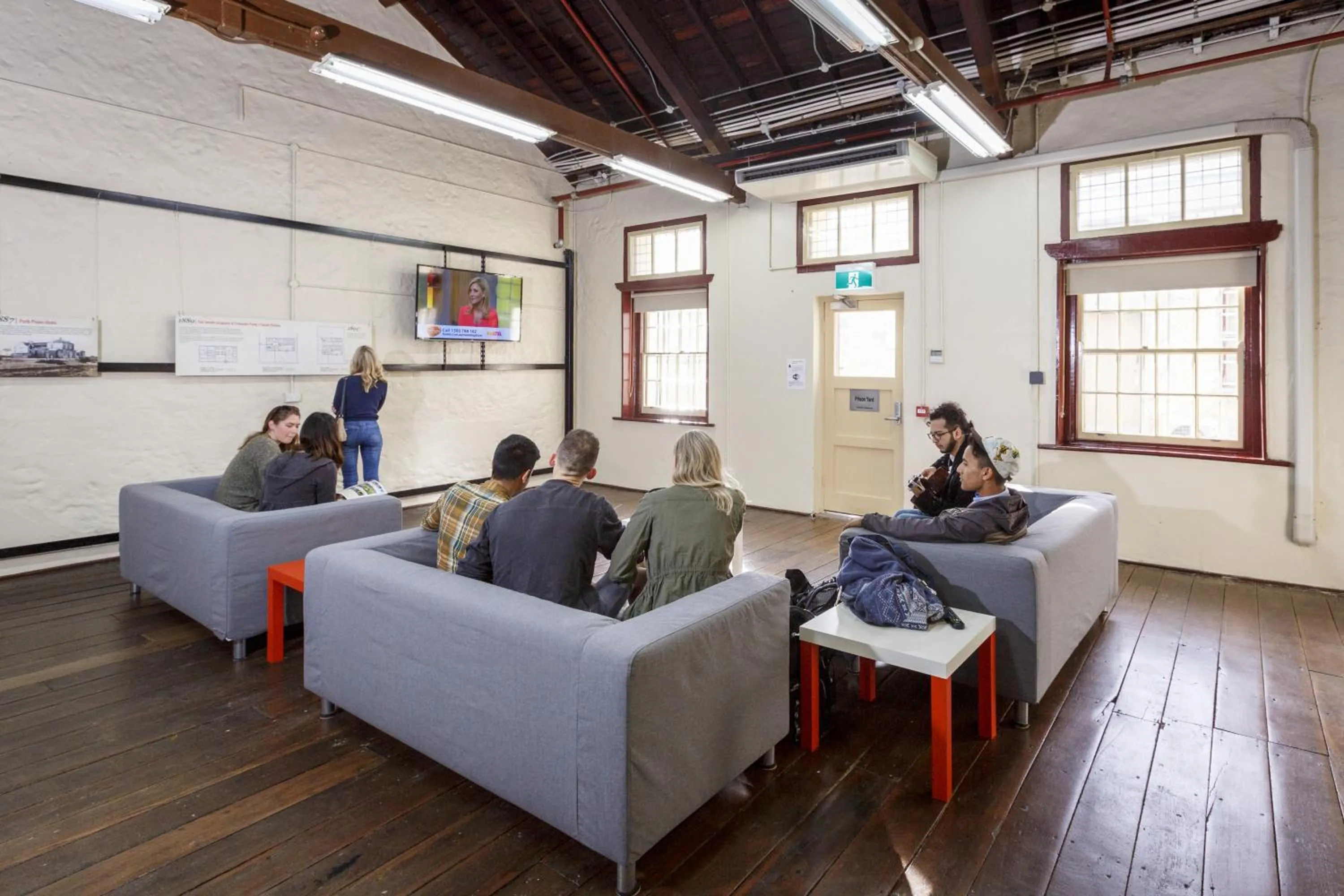 Communal lounge/ TV room in YHA Fremantle Prison