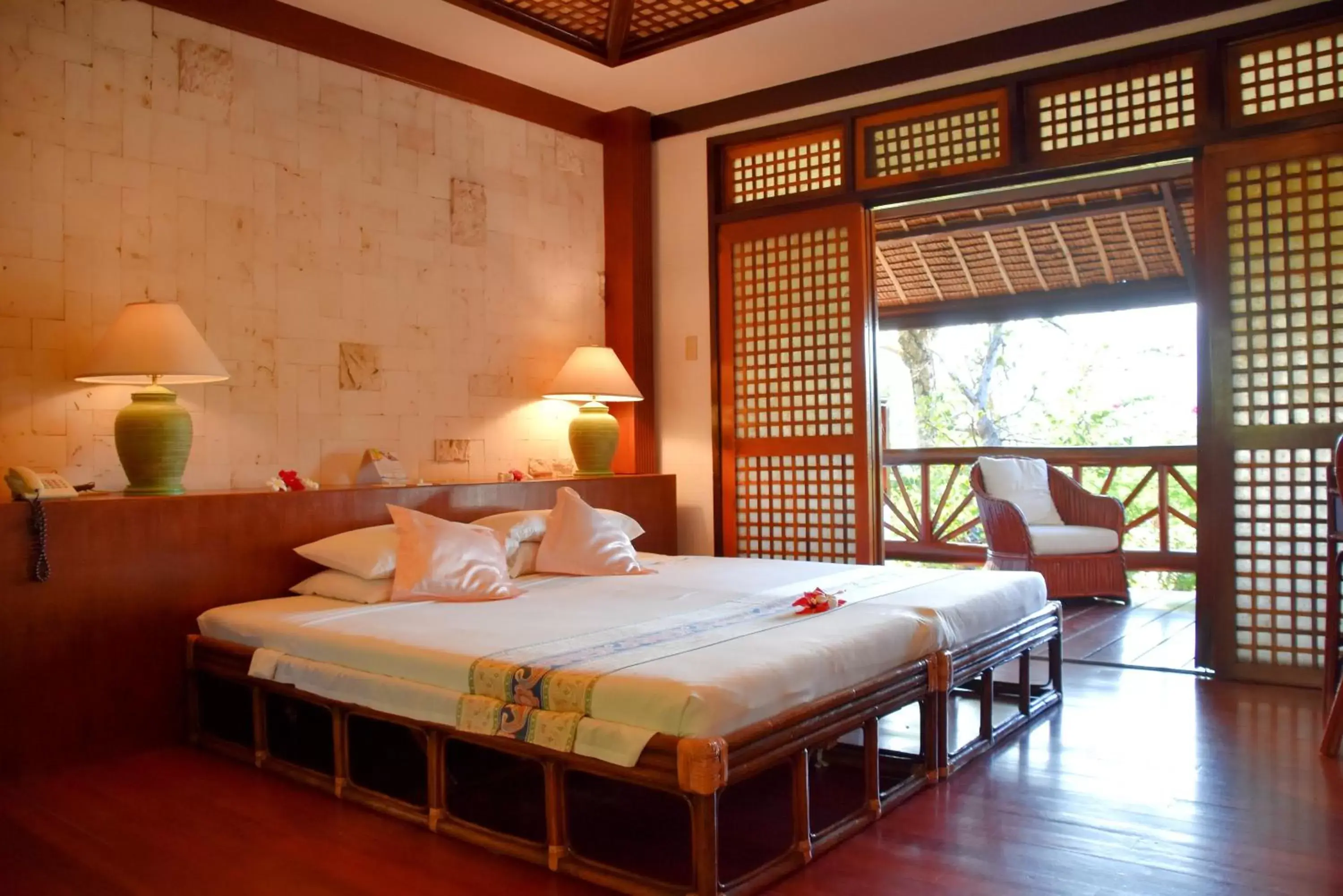 Bed in Badian Island Wellness Resort