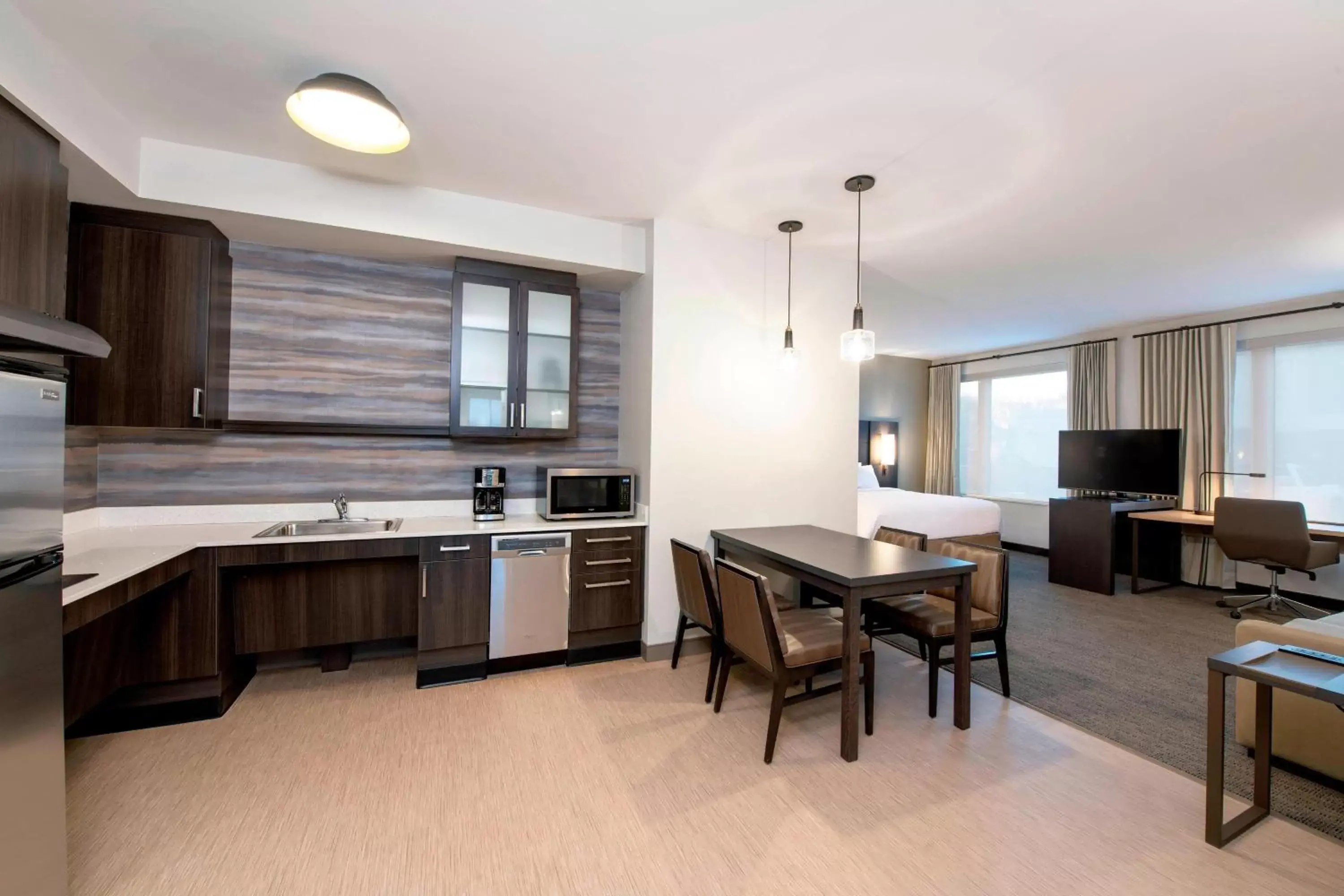 Living room, Kitchen/Kitchenette in Residence Inn by Marriott Winnipeg