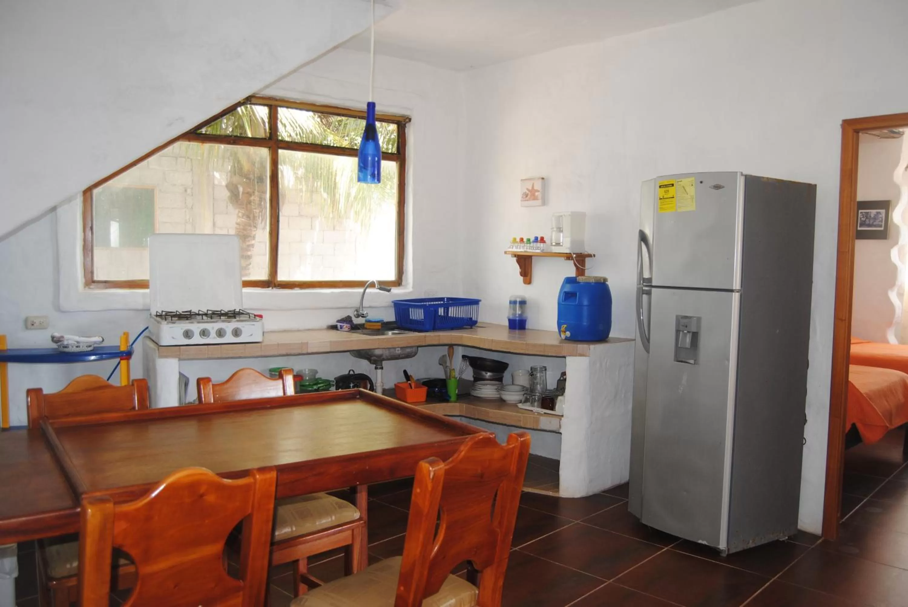 Kitchen or kitchenette in Hostal Galapagos by Bar de Beto