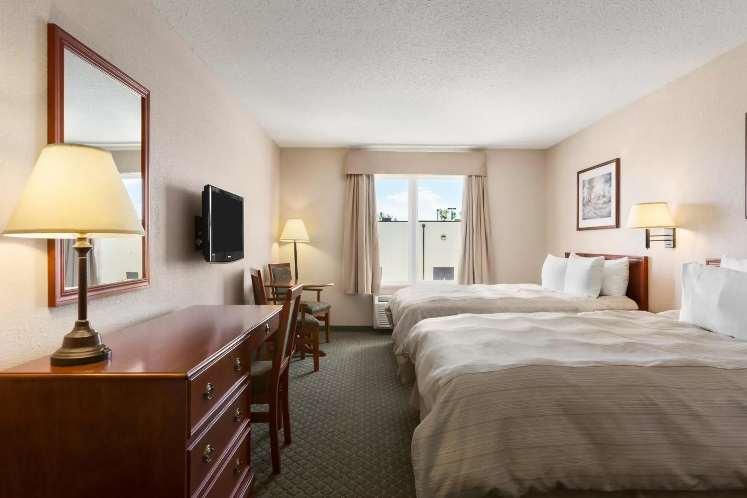 Bed, TV/Entertainment Center in Days Inn & Suites by Wyndham Winkler