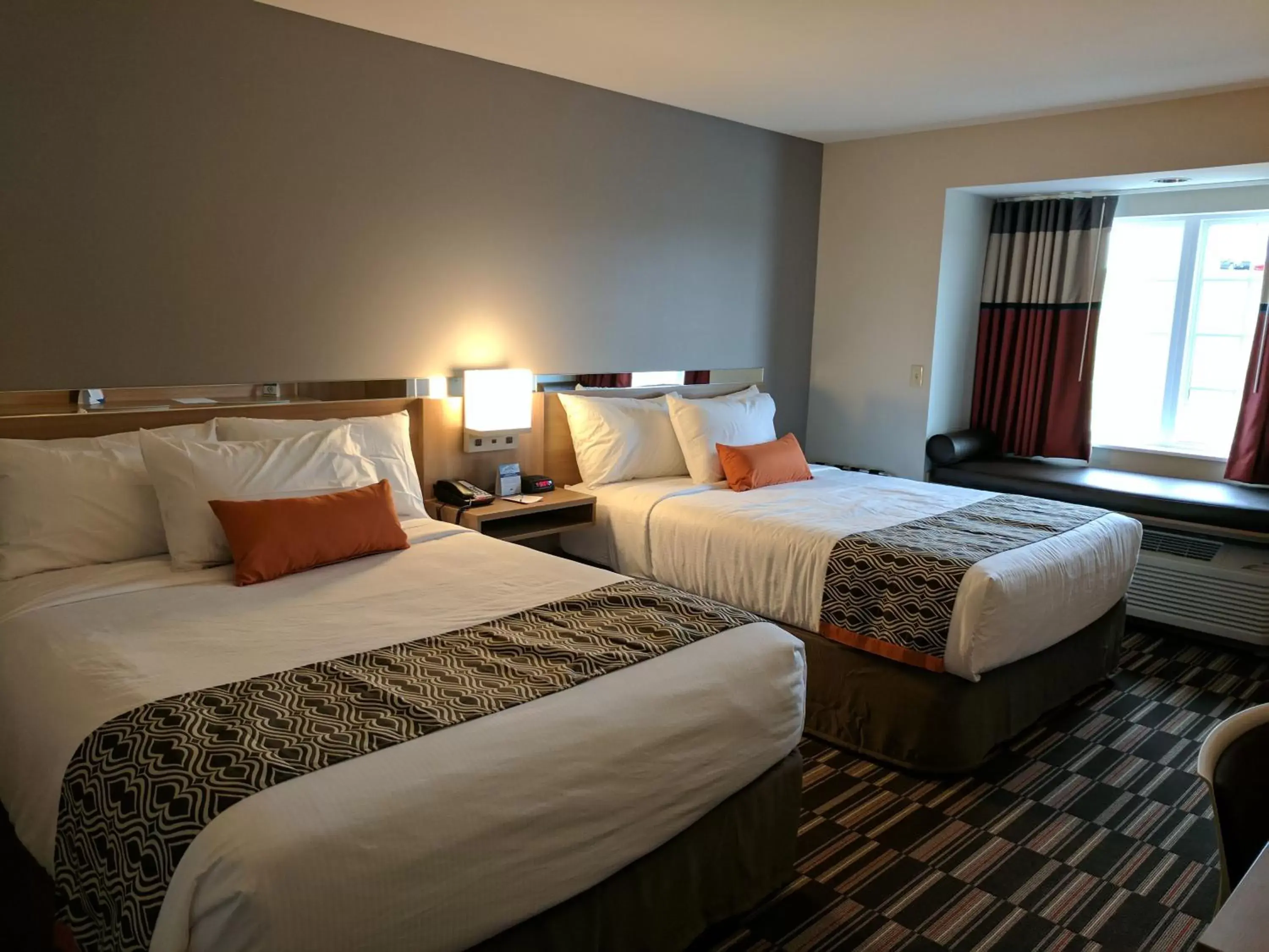 Bed in Microtel Inn & Suites by Wyndham Clarion