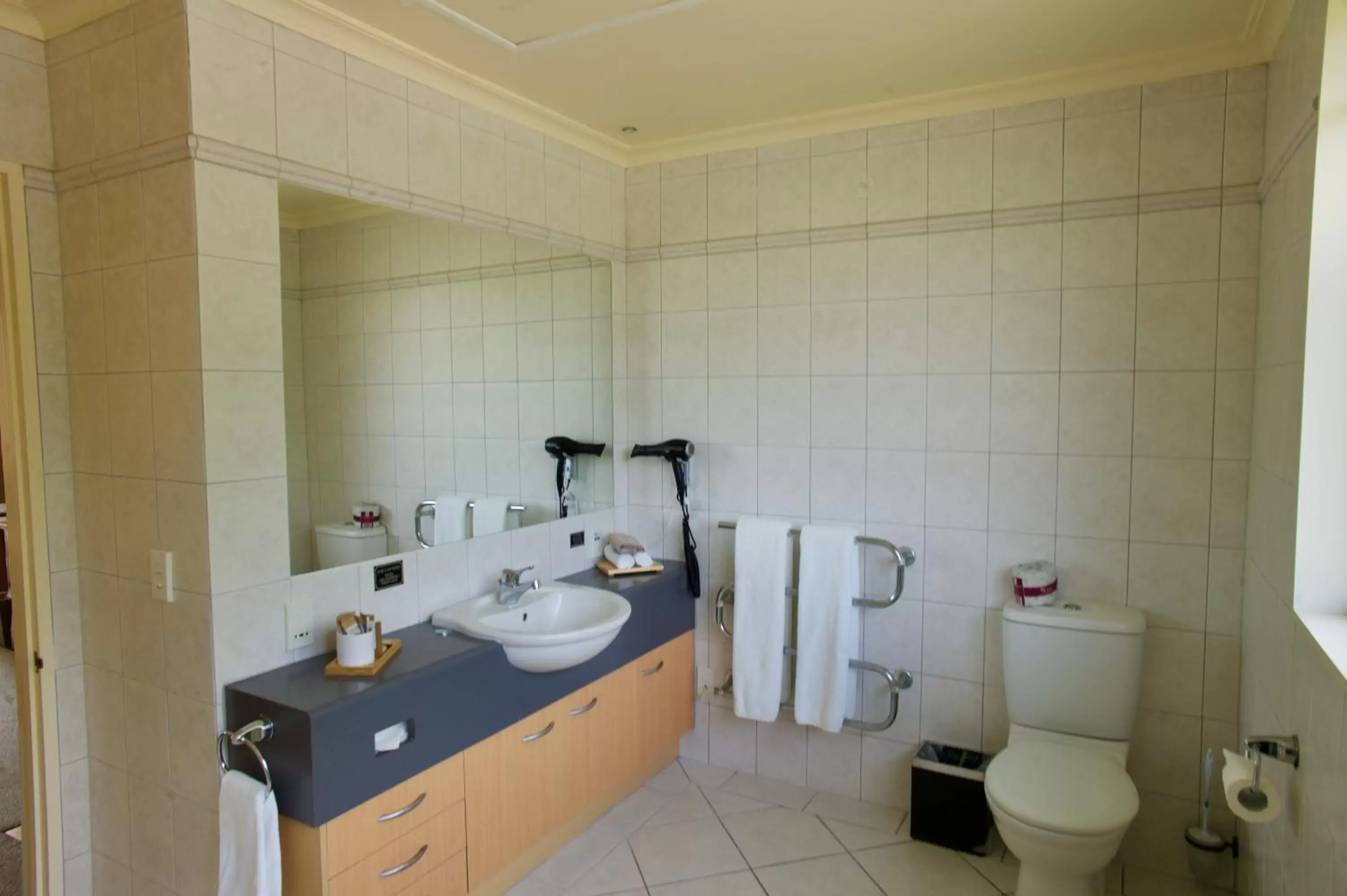 Toilet, Bathroom in Regal Palms Resort