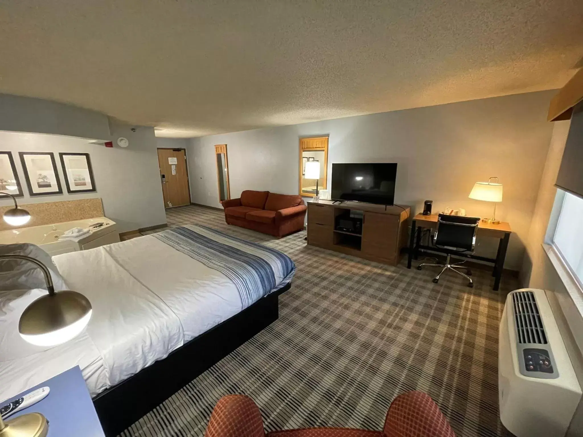 Photo of the whole room in AmericInn by Wyndham Sayre