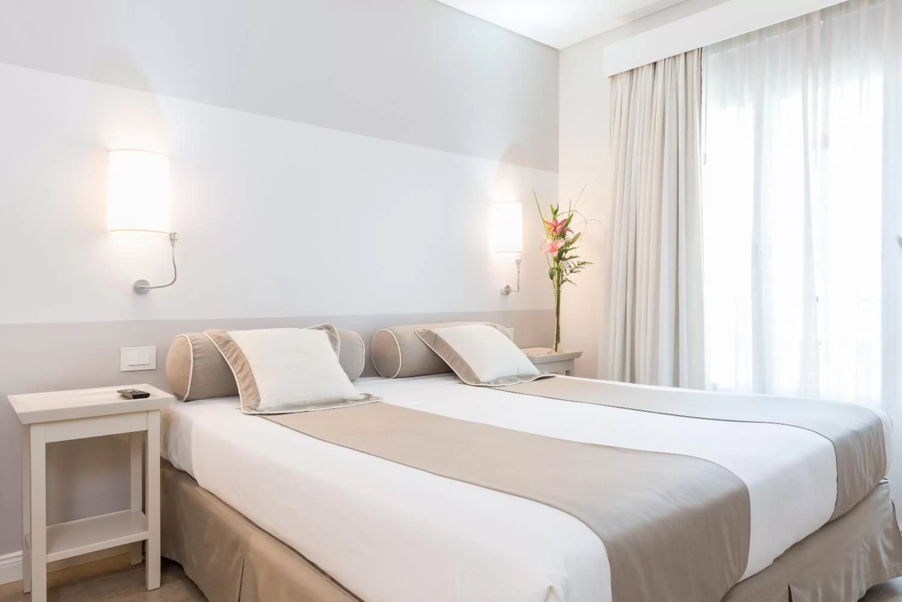 Bed in Loi Suites Recoleta Hotel