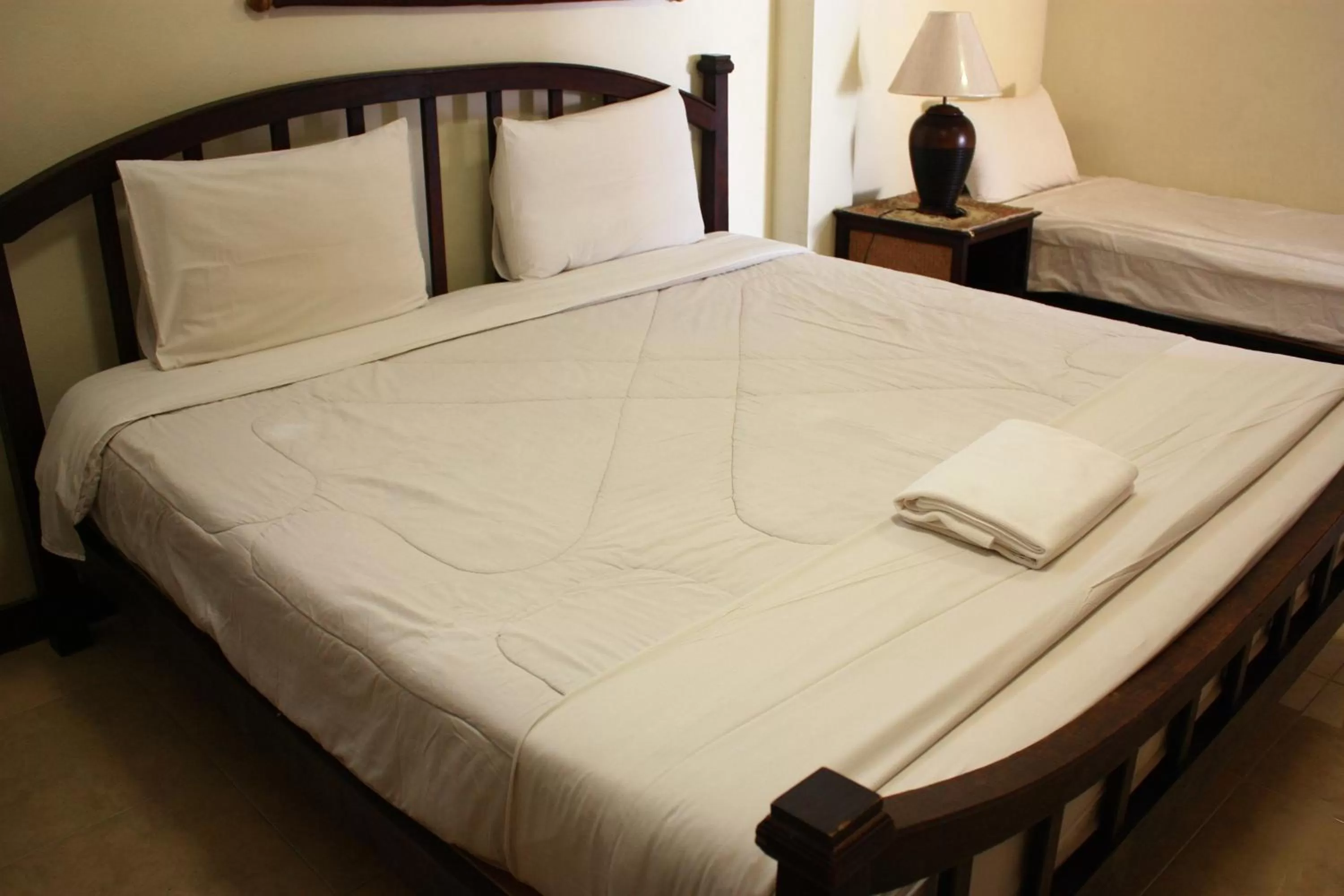 Bed in โรงแรมตีฆ้อง - Tri Gong Hotel