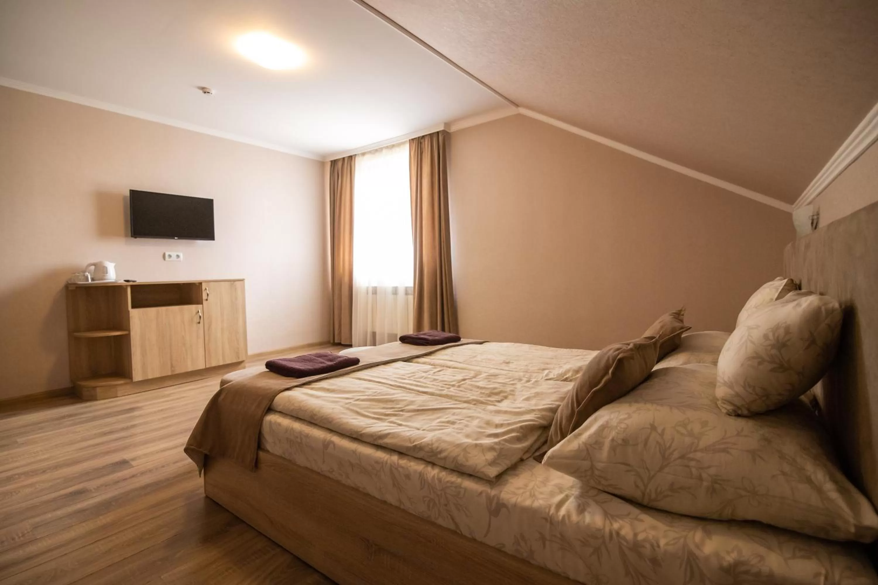 Photo of the whole room, Bed in Praktik Hotel & Restaurant