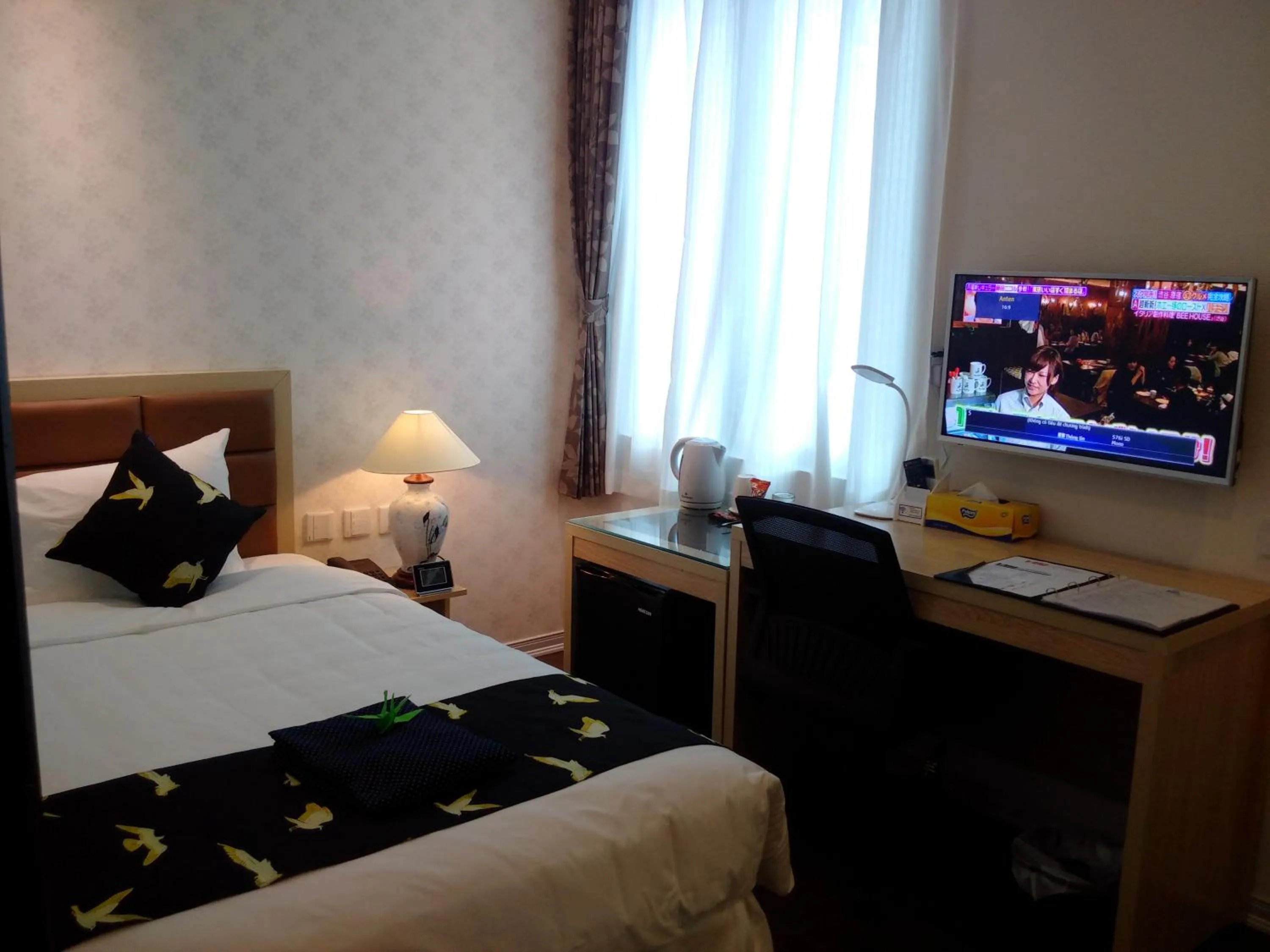 Bed in Momizi Business Hotel