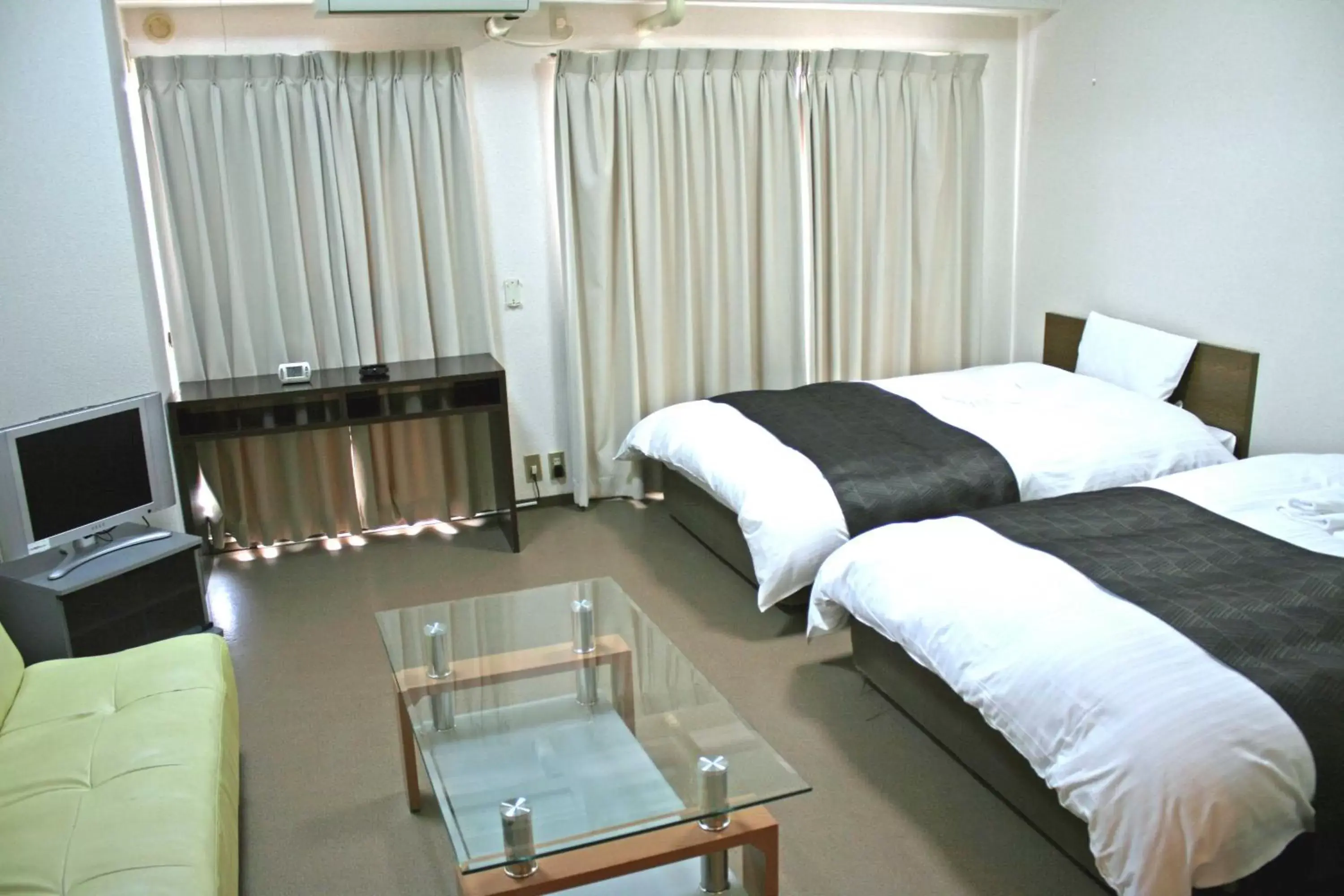 Bed in HOTEL CITY INN WAKAYAMA Wakayama-Ekimae
