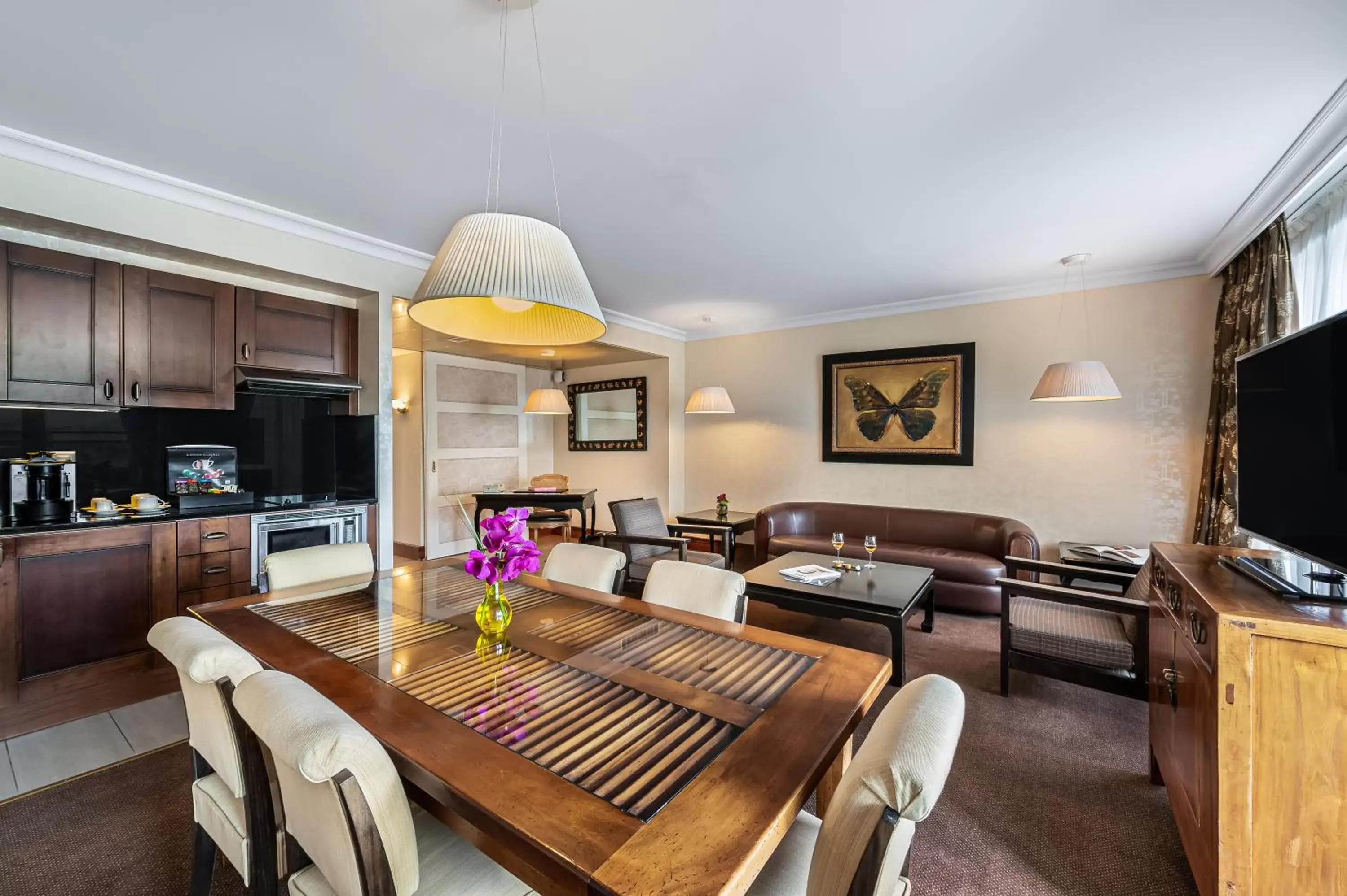 Living room, Dining Area in Royal Manotel