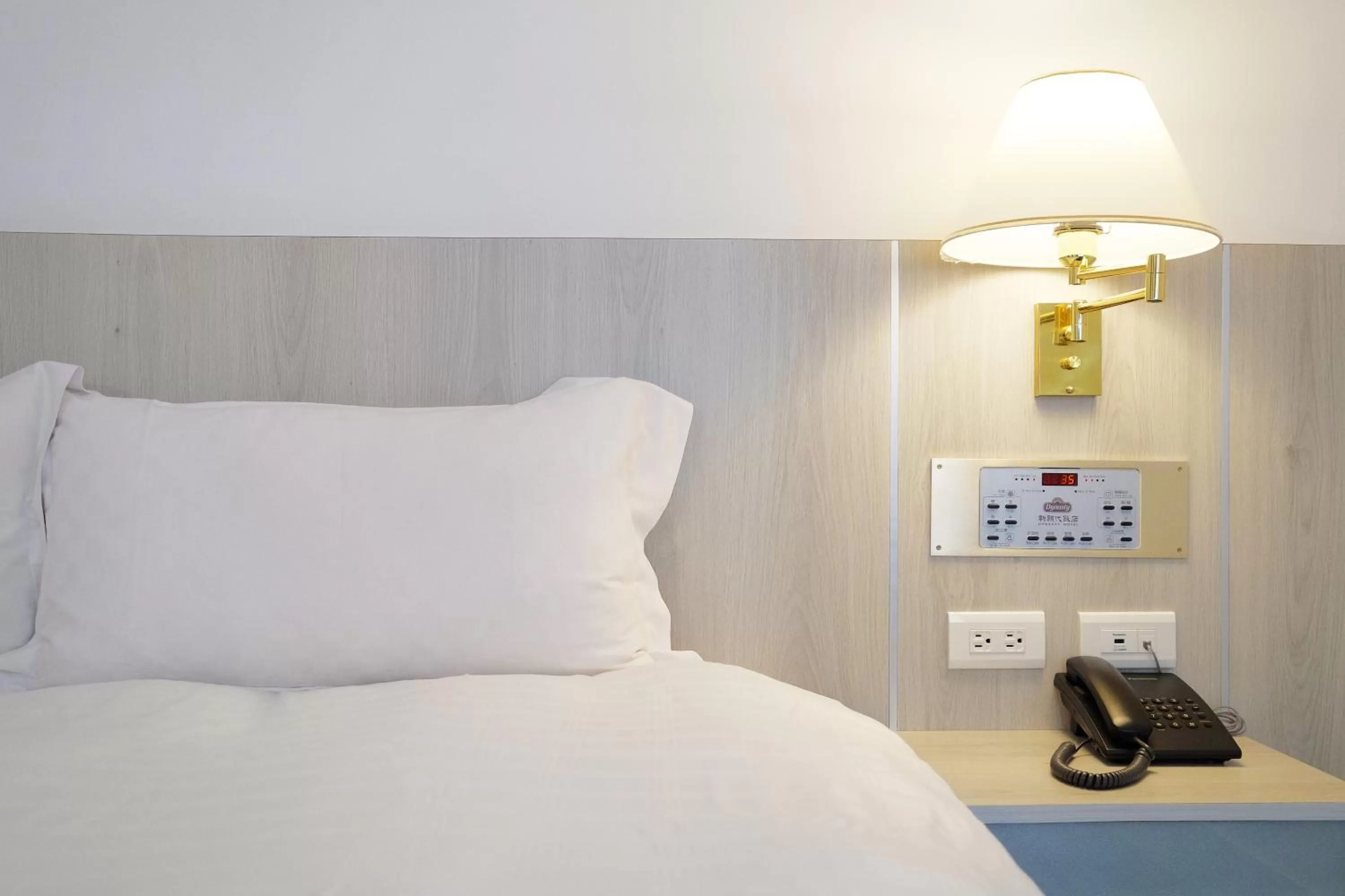 Bed in Dynasty Hotel