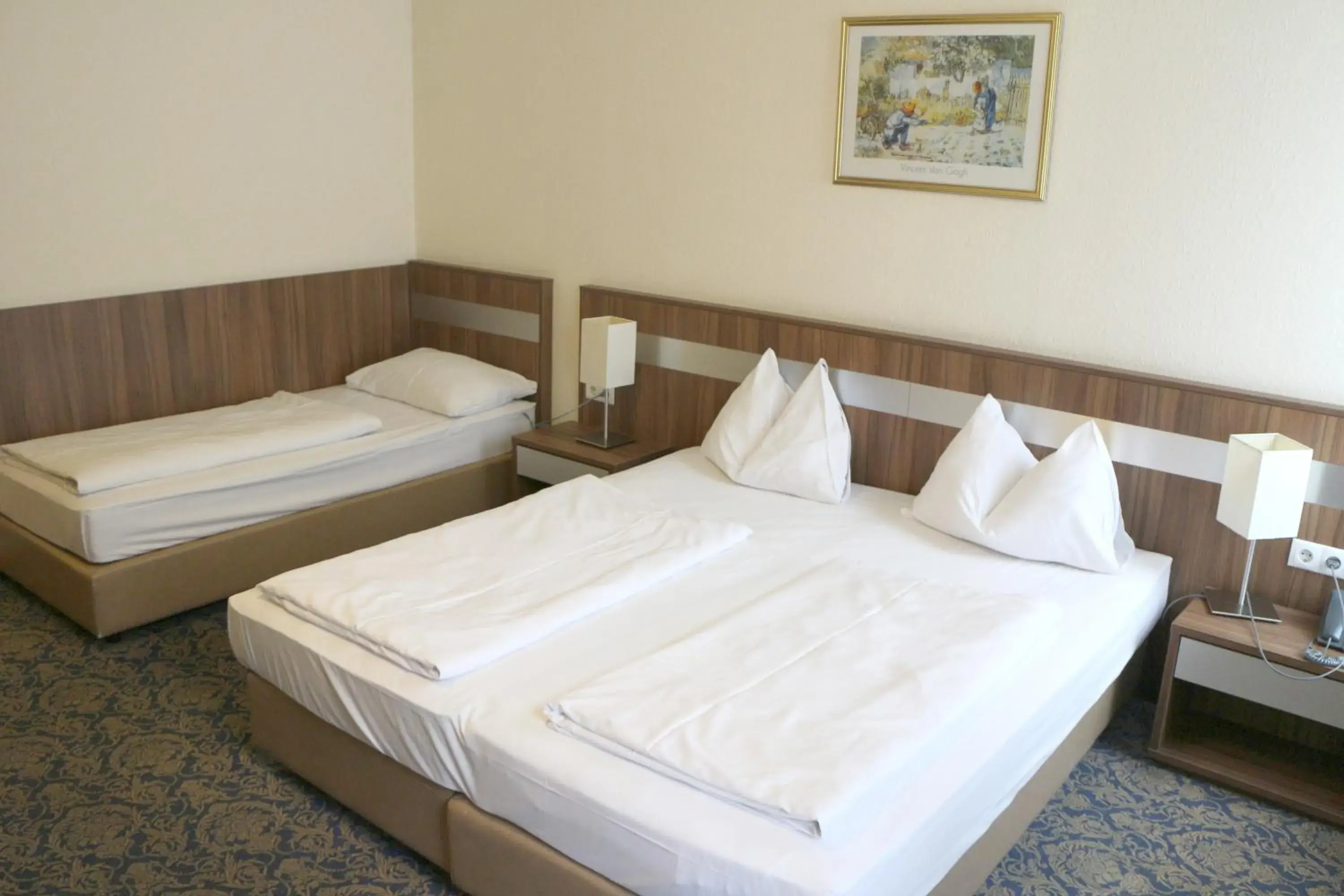 Bed in Hotel Carina