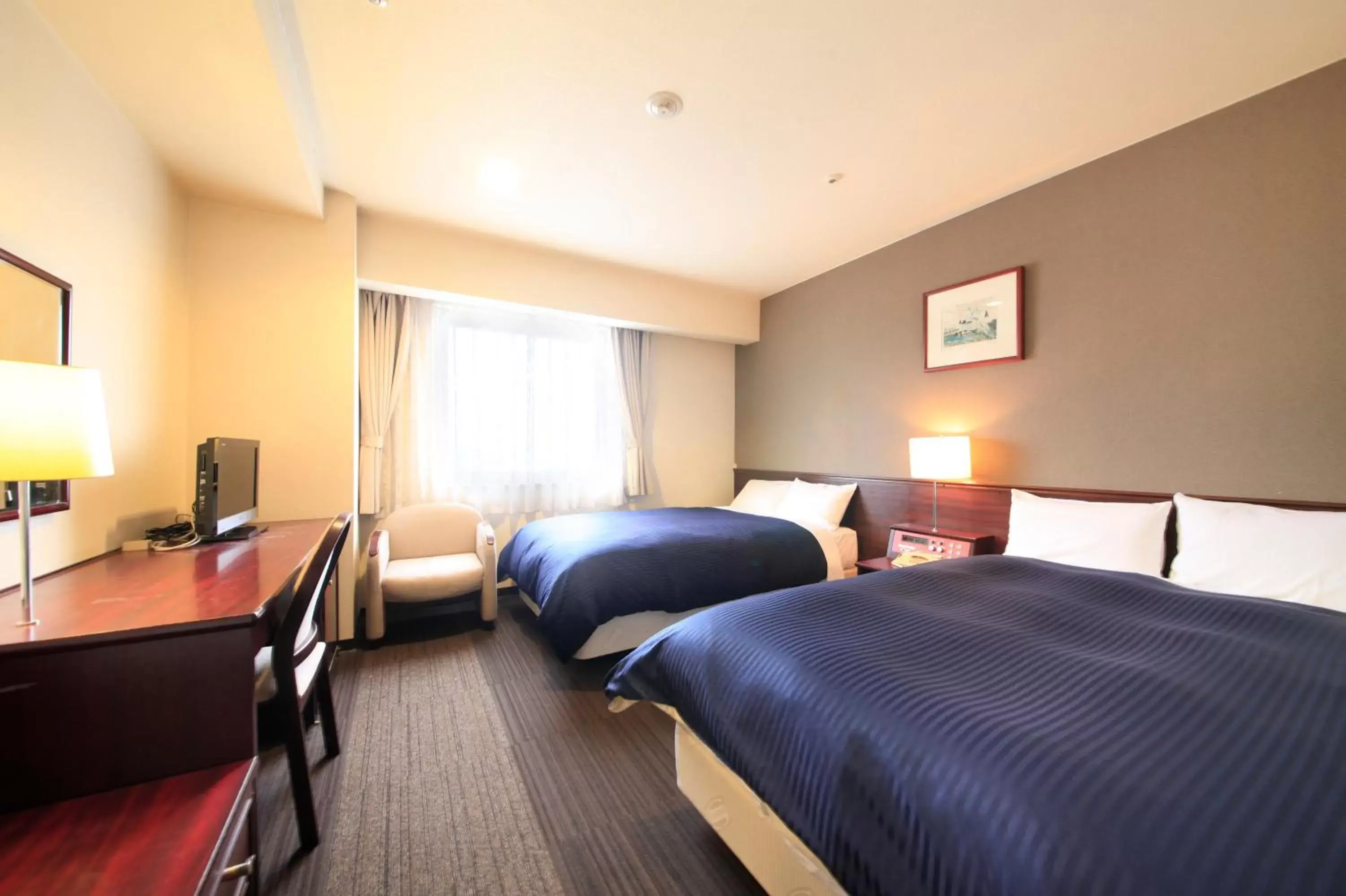 Photo of the whole room, Bed in Quintessa Hotel Ogaki