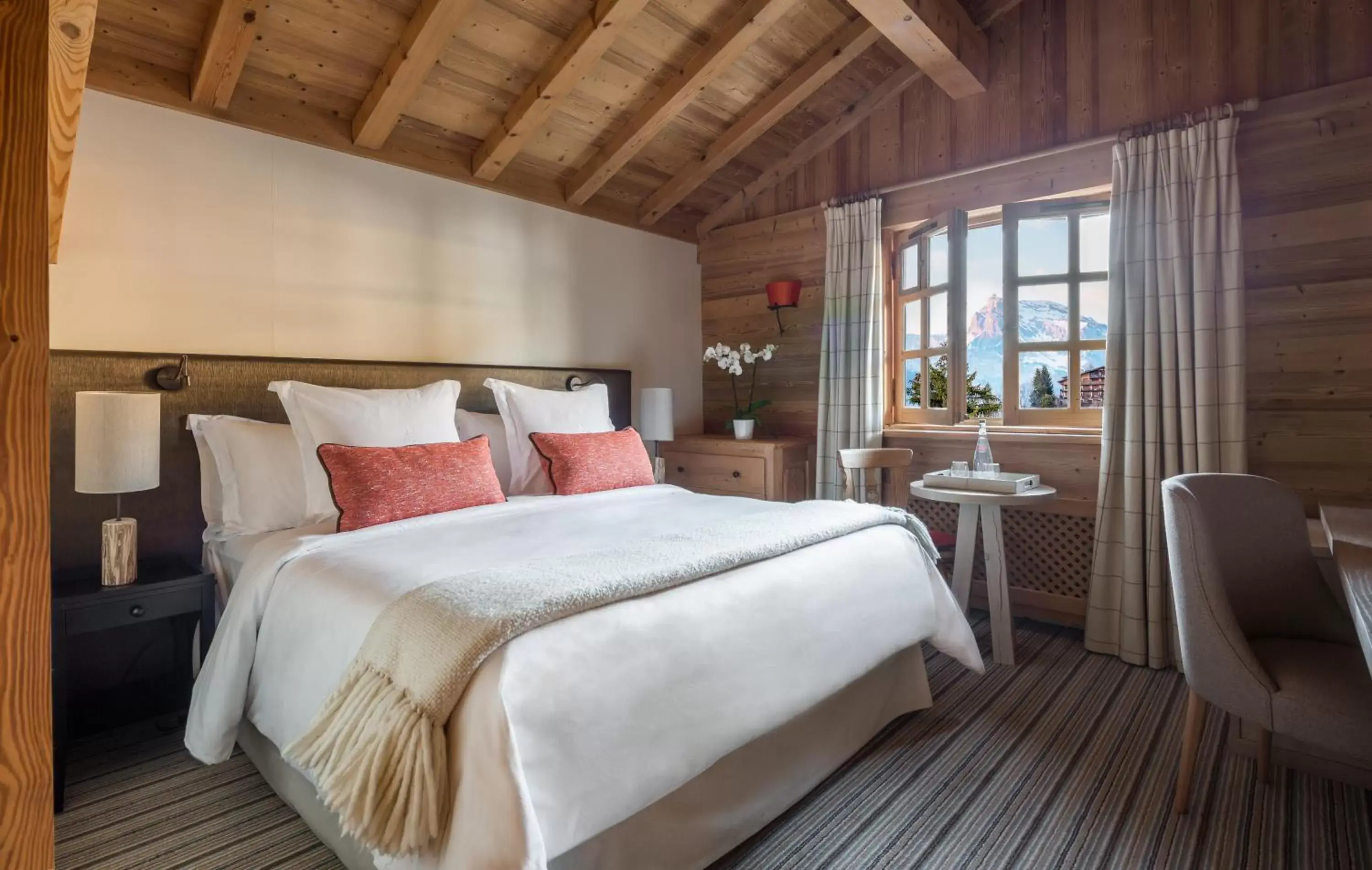 Bed in Les Chalets du Mont d'Arbois Megeve, a Four Seasons Hotel